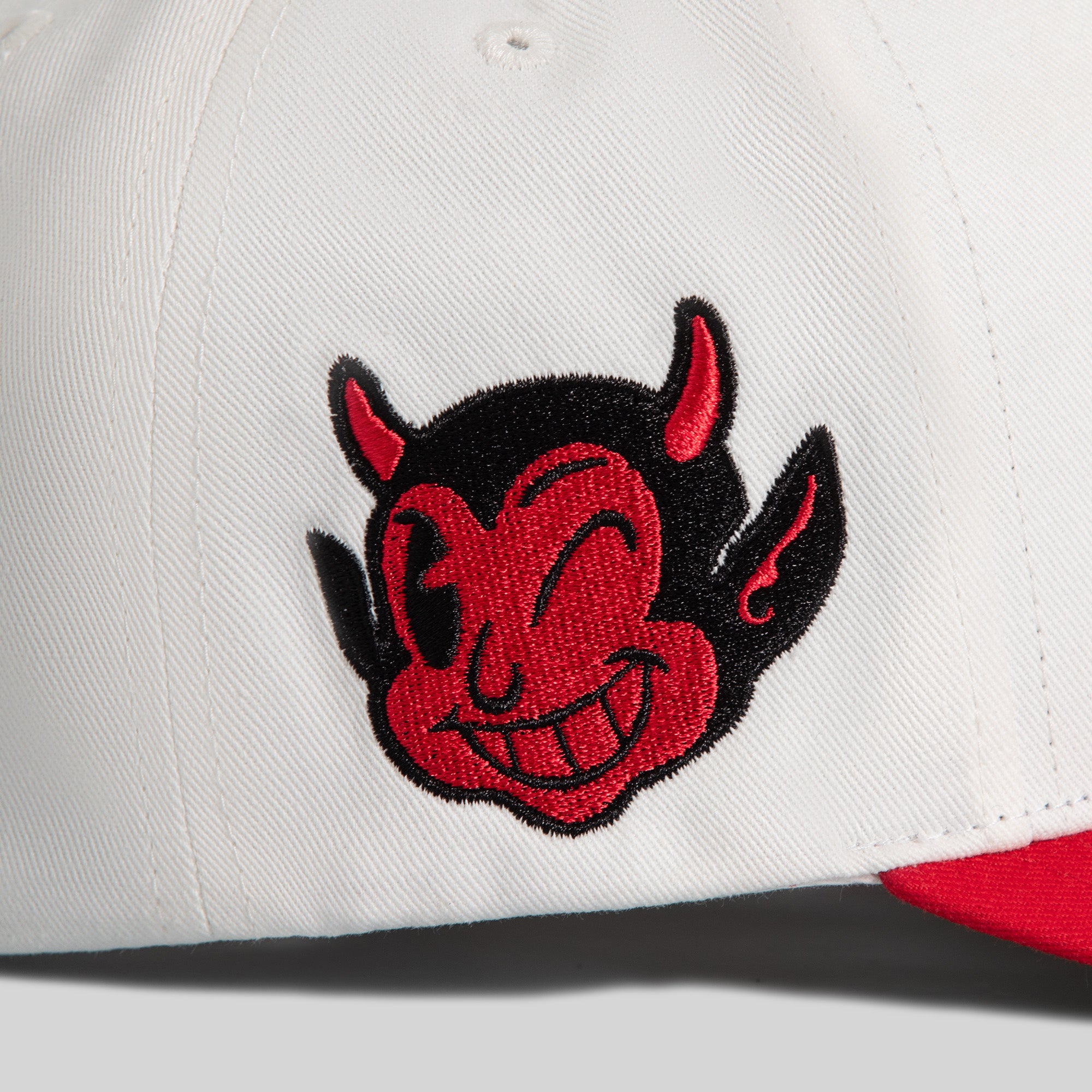 WINNERS AND SINNERS OFF WHITE VARSITY RED TWILL TRUCKER