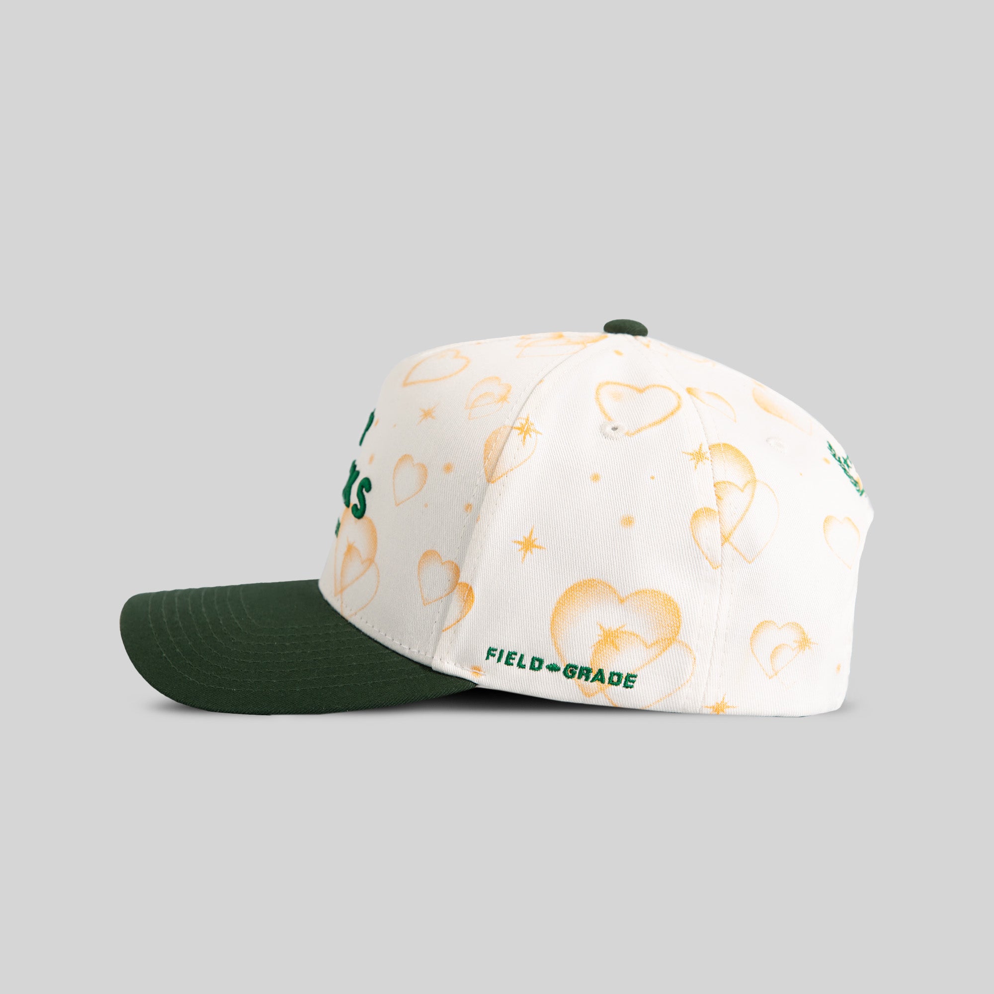 NO F*CKS GIVEN MAJESTIC HEARTS OFF WHITE EMERALD TWILL TRUCKER