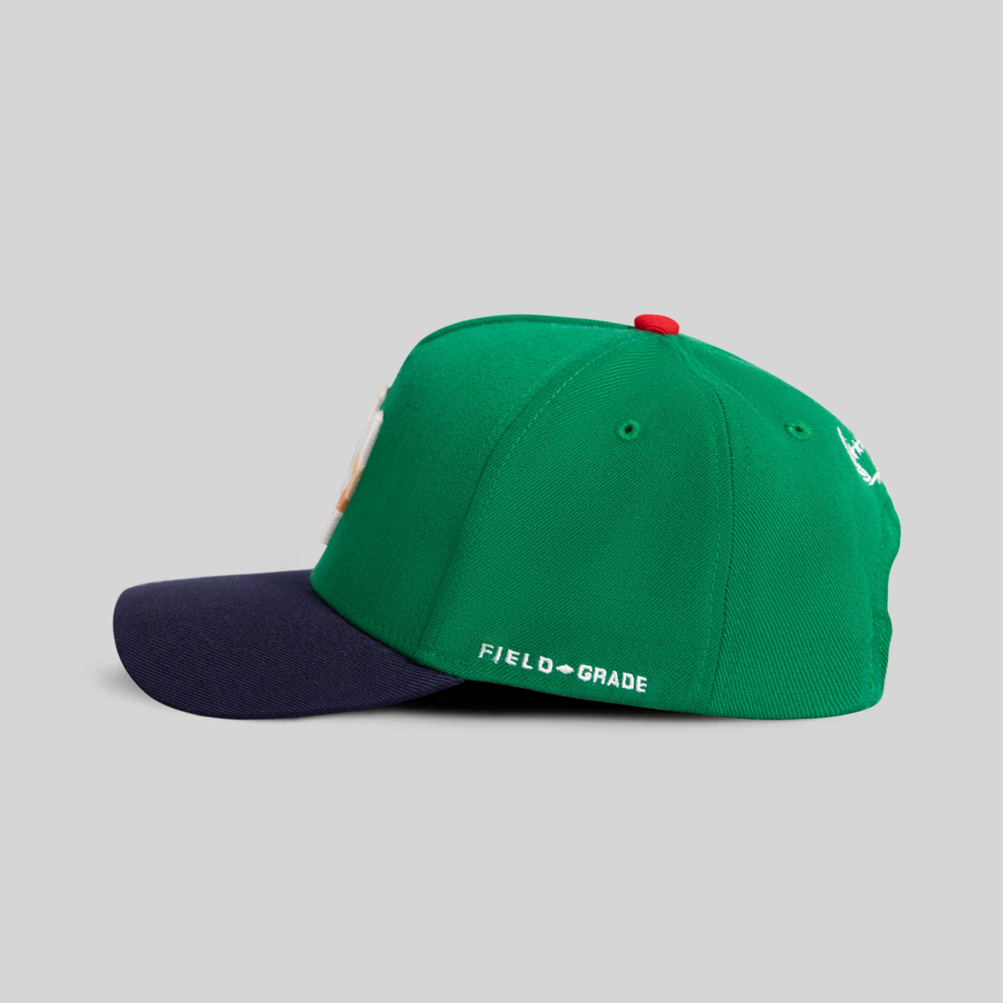 FIELD GRADE X KURVE STUDIO NY IS HEALING KELLY GREEN NAVY TRUCKER