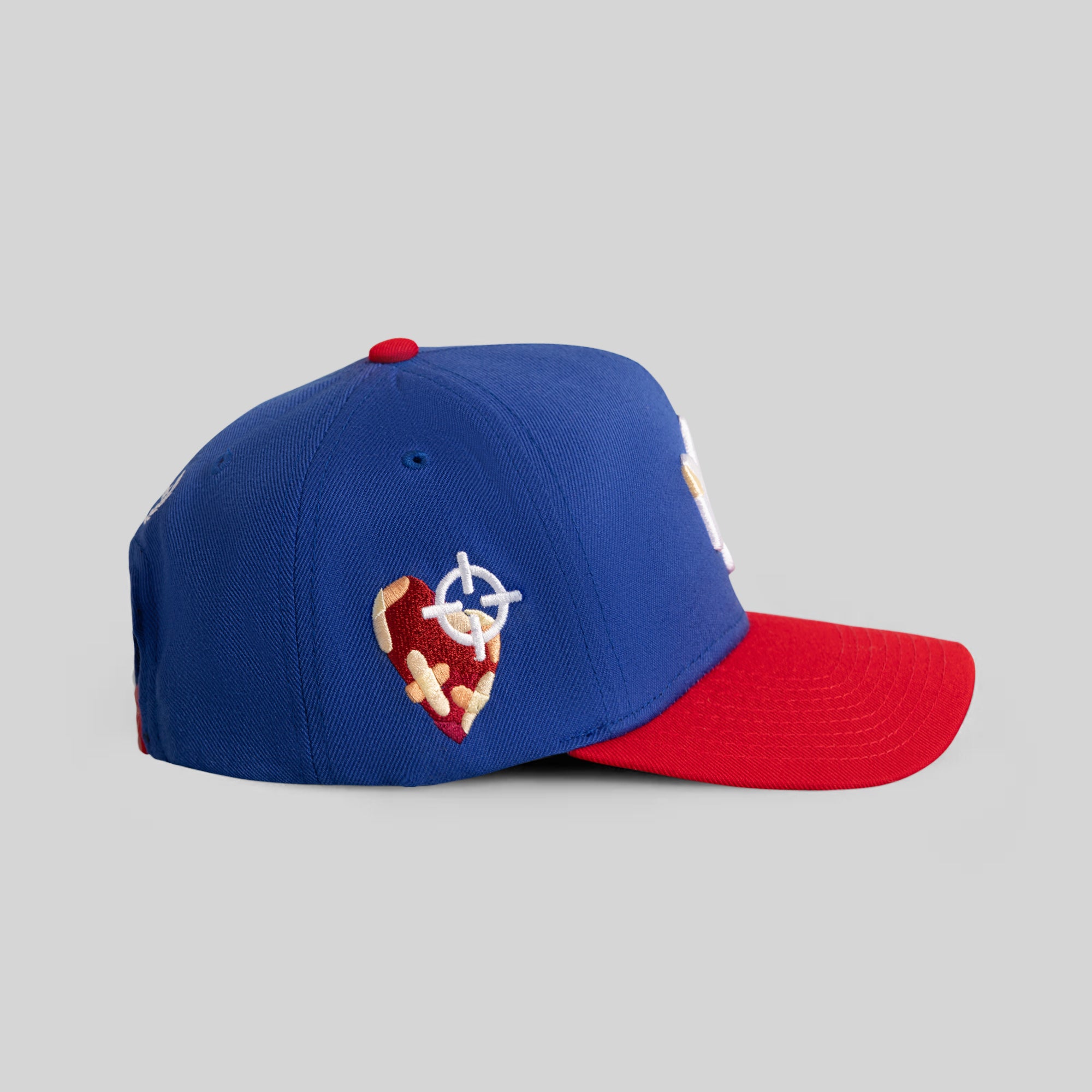 FIELD GRADE X KURVE STUDIO NY IS HEALING GAME ROYAL VARSITY RED TRUCKER