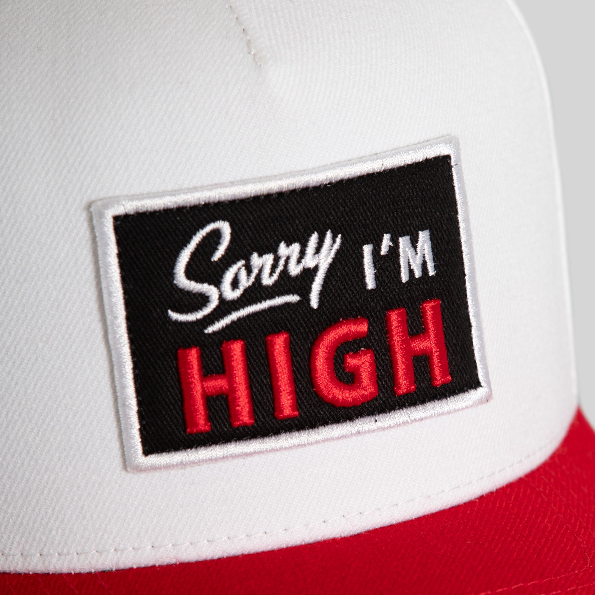 SORRY I'M HIGH OFF WHITE RED WOOL TRUCKER