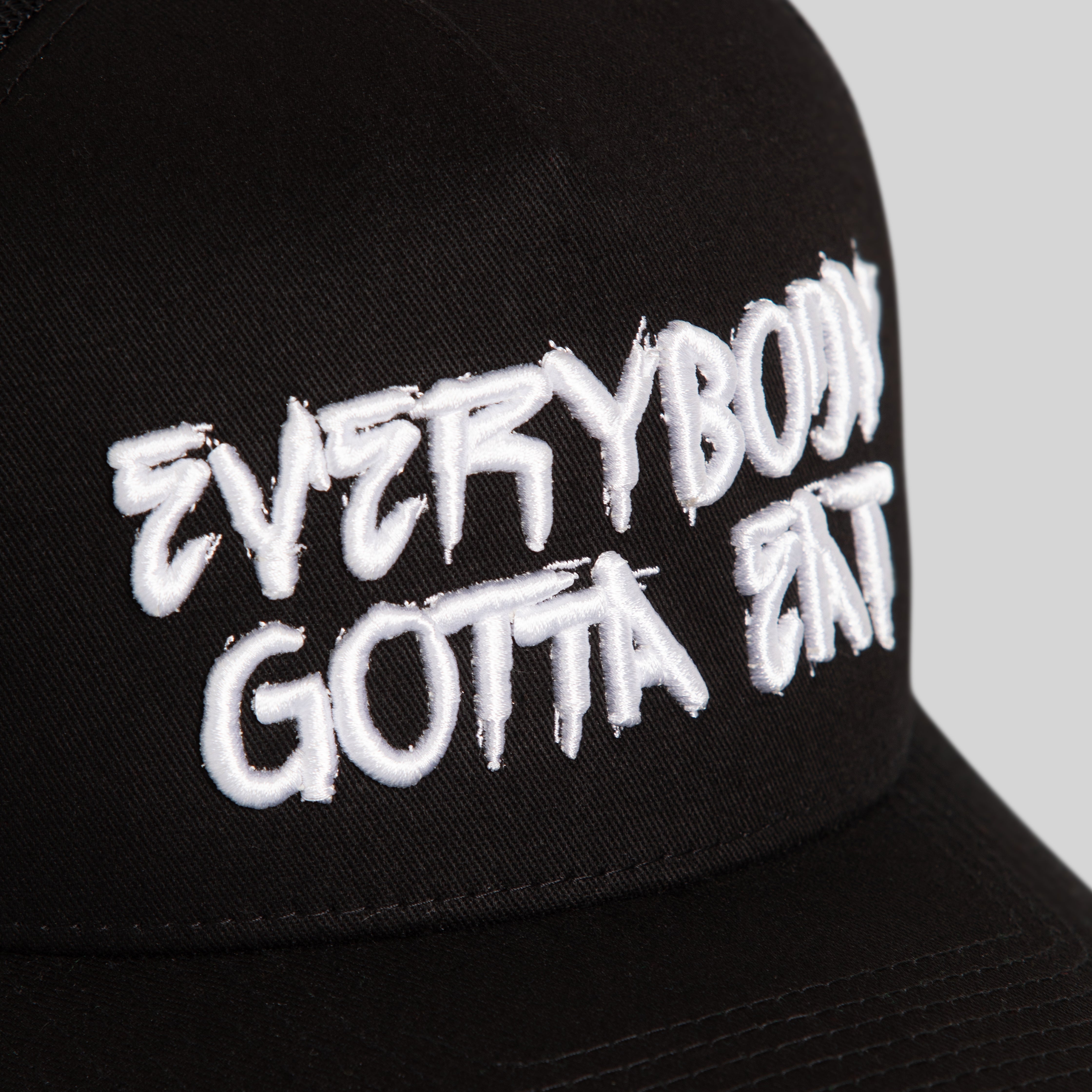 EVERYBODY GOTTA EAT BLACK TWILL MESH TRUCKER