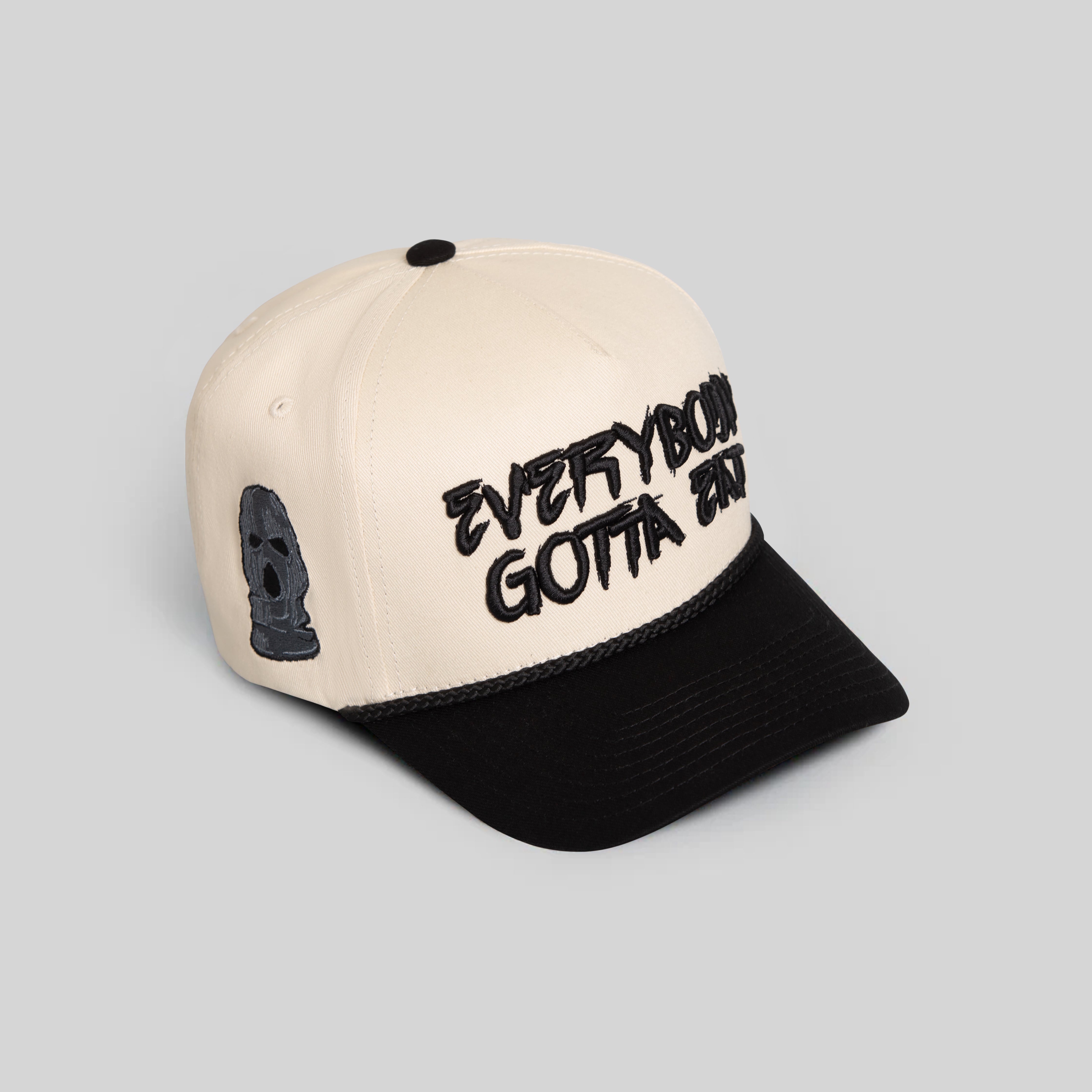 EVERYBODY GOTTA EAT SAND BLACK TWILL TRUCKER