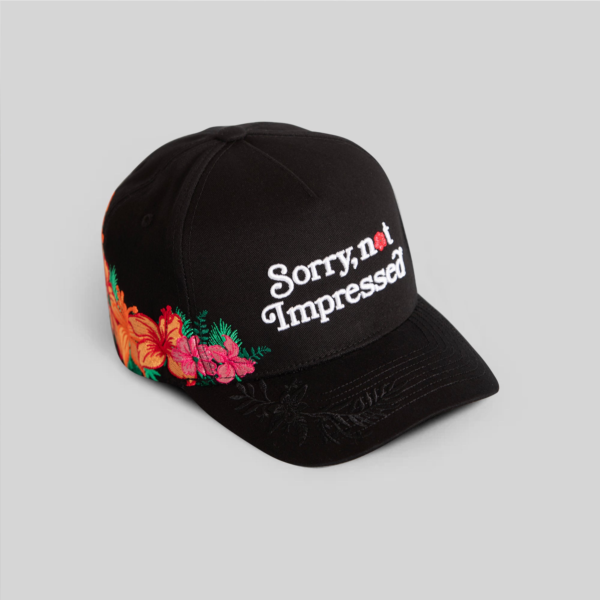 SORRY NOT IMPRESSED BLACK FLORAL TWILL TRUCKER