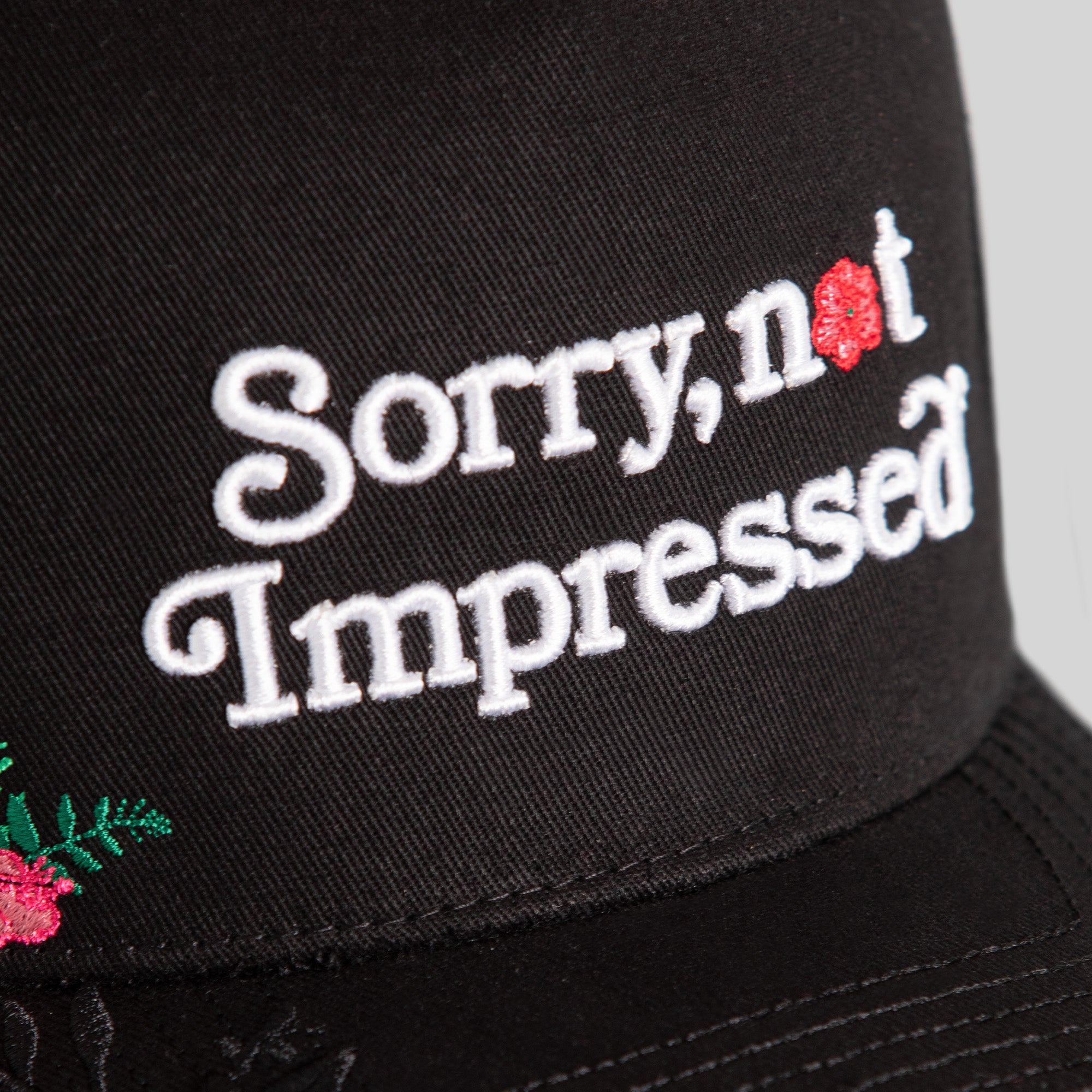 SORRY NOT IMPRESSED BLACK FLORAL TWILL TRUCKER