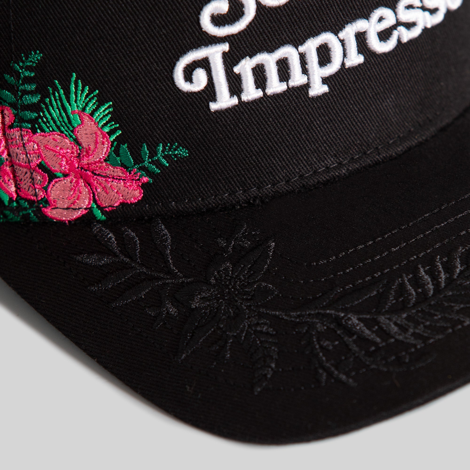 SORRY NOT IMPRESSED BLACK FLORAL TWILL TRUCKER