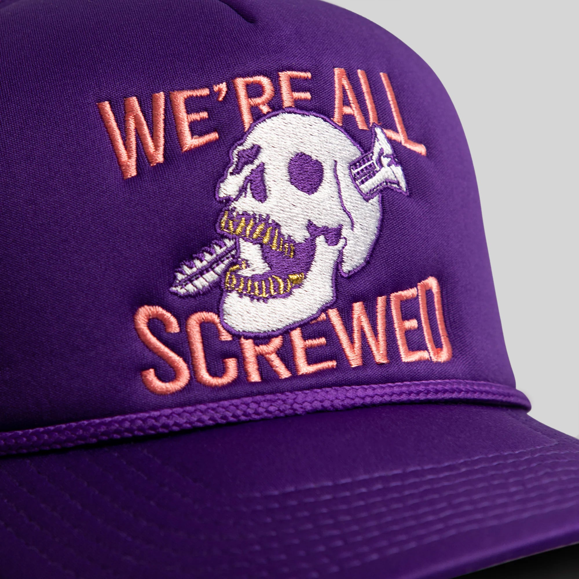 WE'RE ALL SCREWED PURPLE TRUCKER HAT