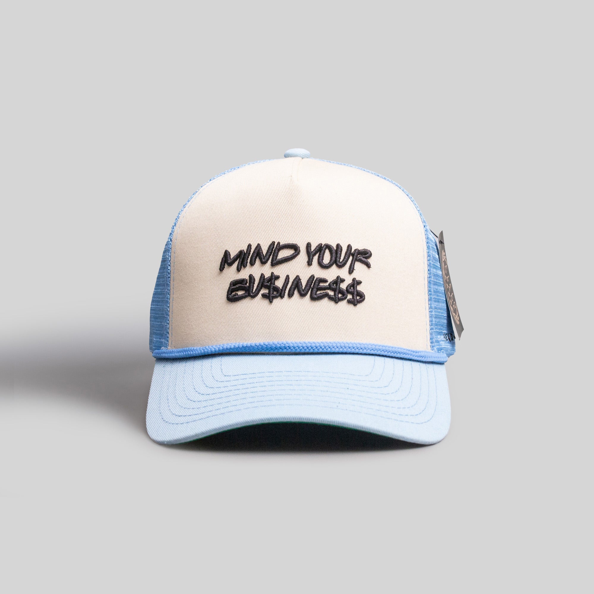 MIND YOUR BUSINESS SAND/UNI BLUE TRUCKER HAT