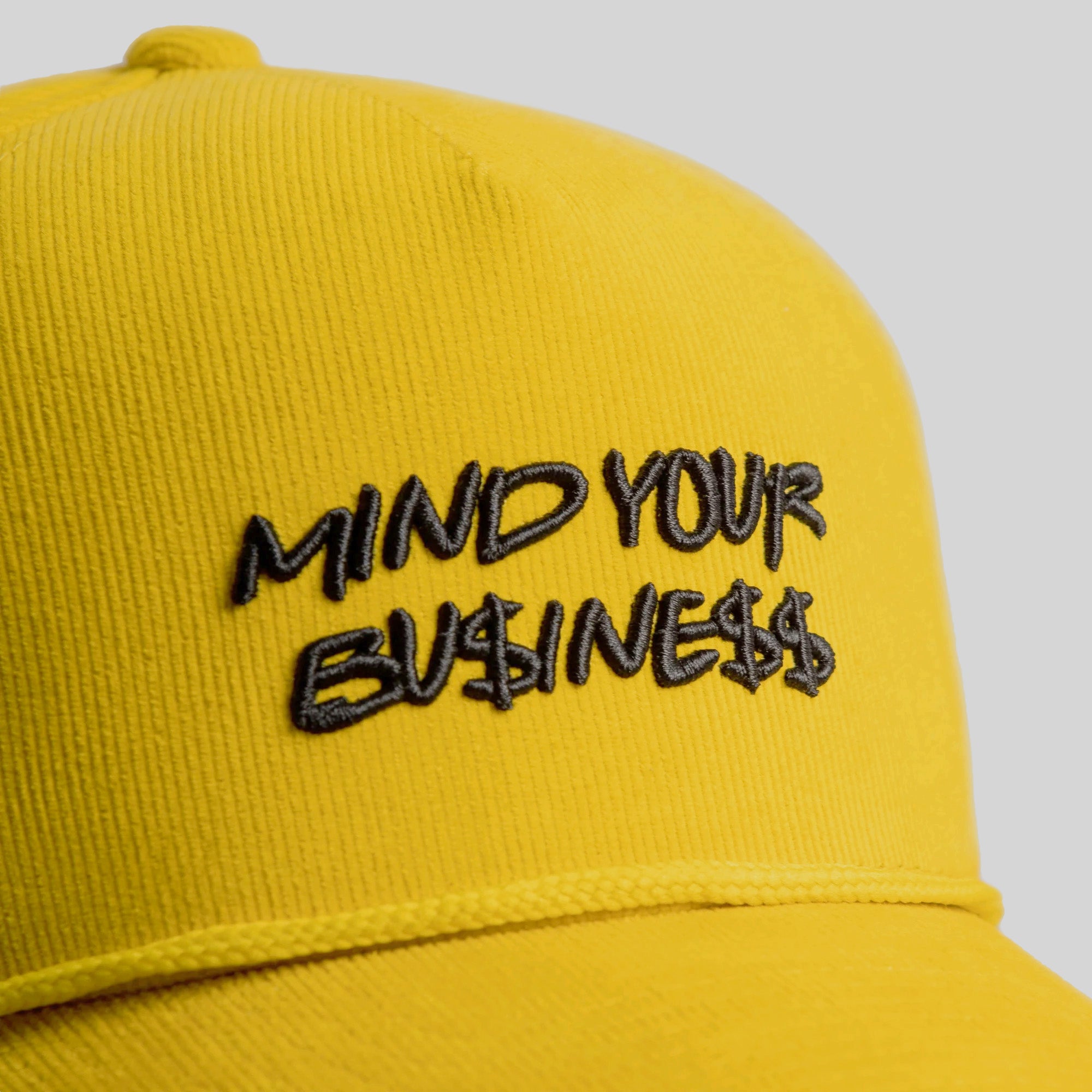 MIND YOUR BUSINESS YELLOW GOLD CORDUROY TRUCKER HAT