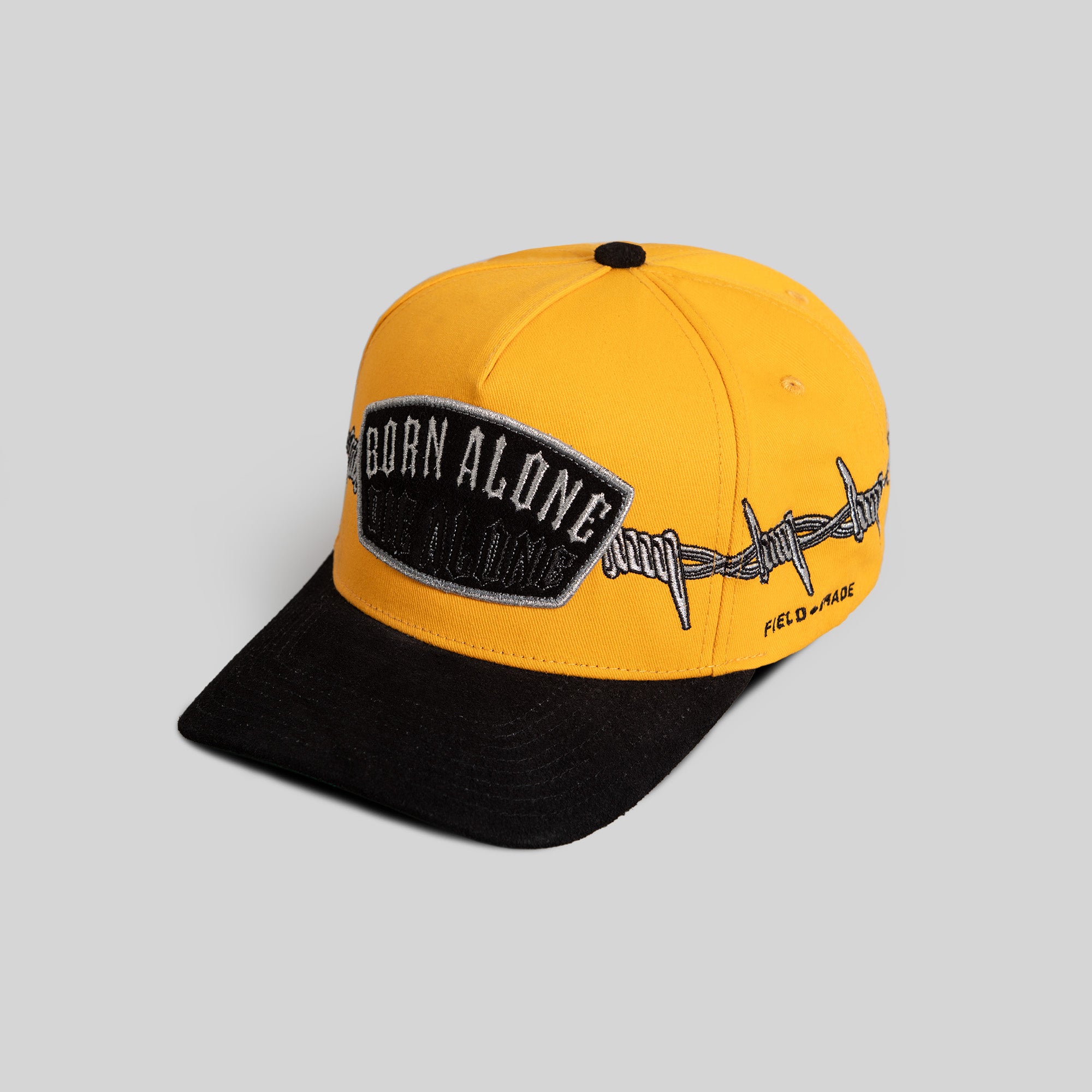 BORN ALONE BARBED WIRE GOLD BLACK TWILL SUEDE TRUCKER