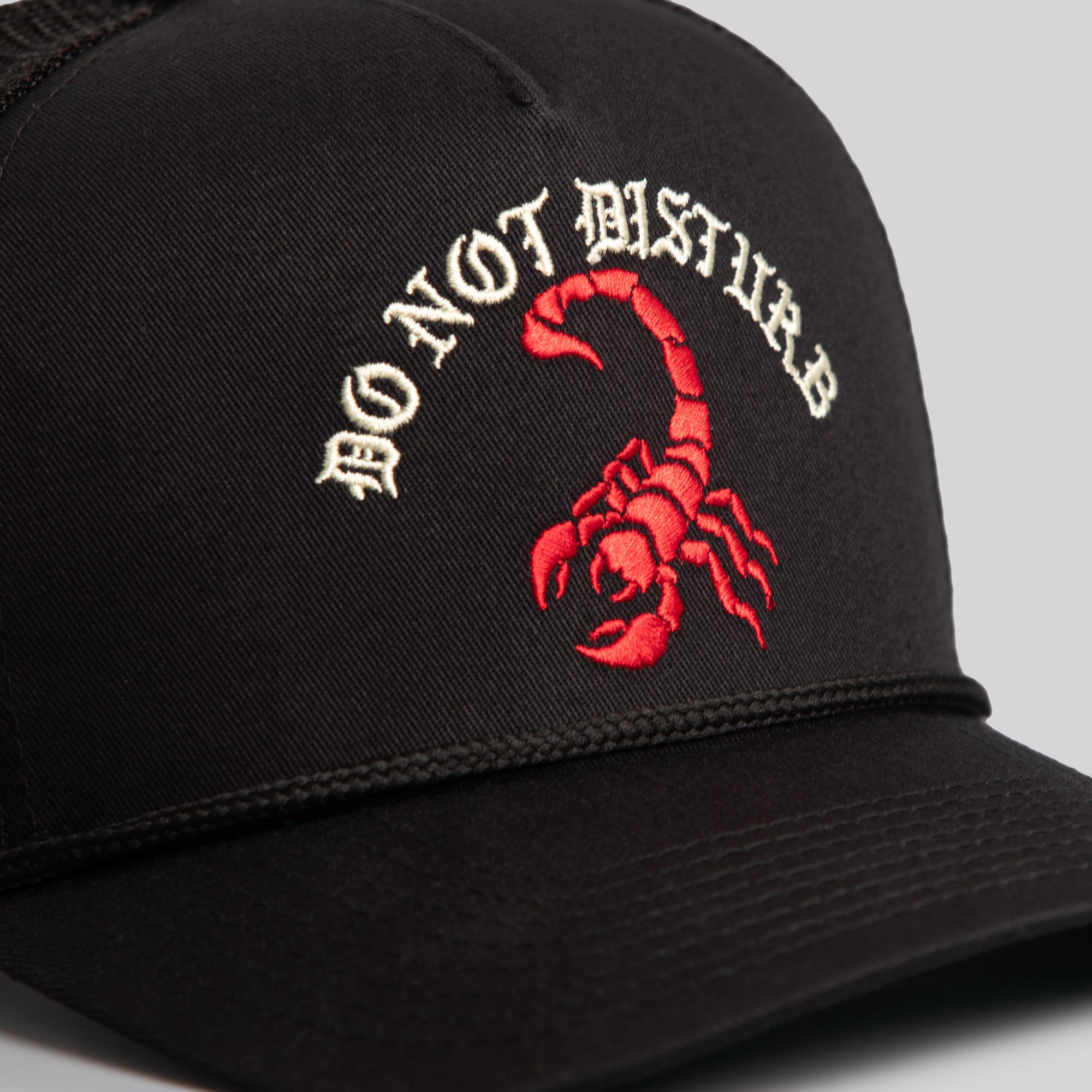 DO NOT DISTURB BLACK TRUCKER HAT