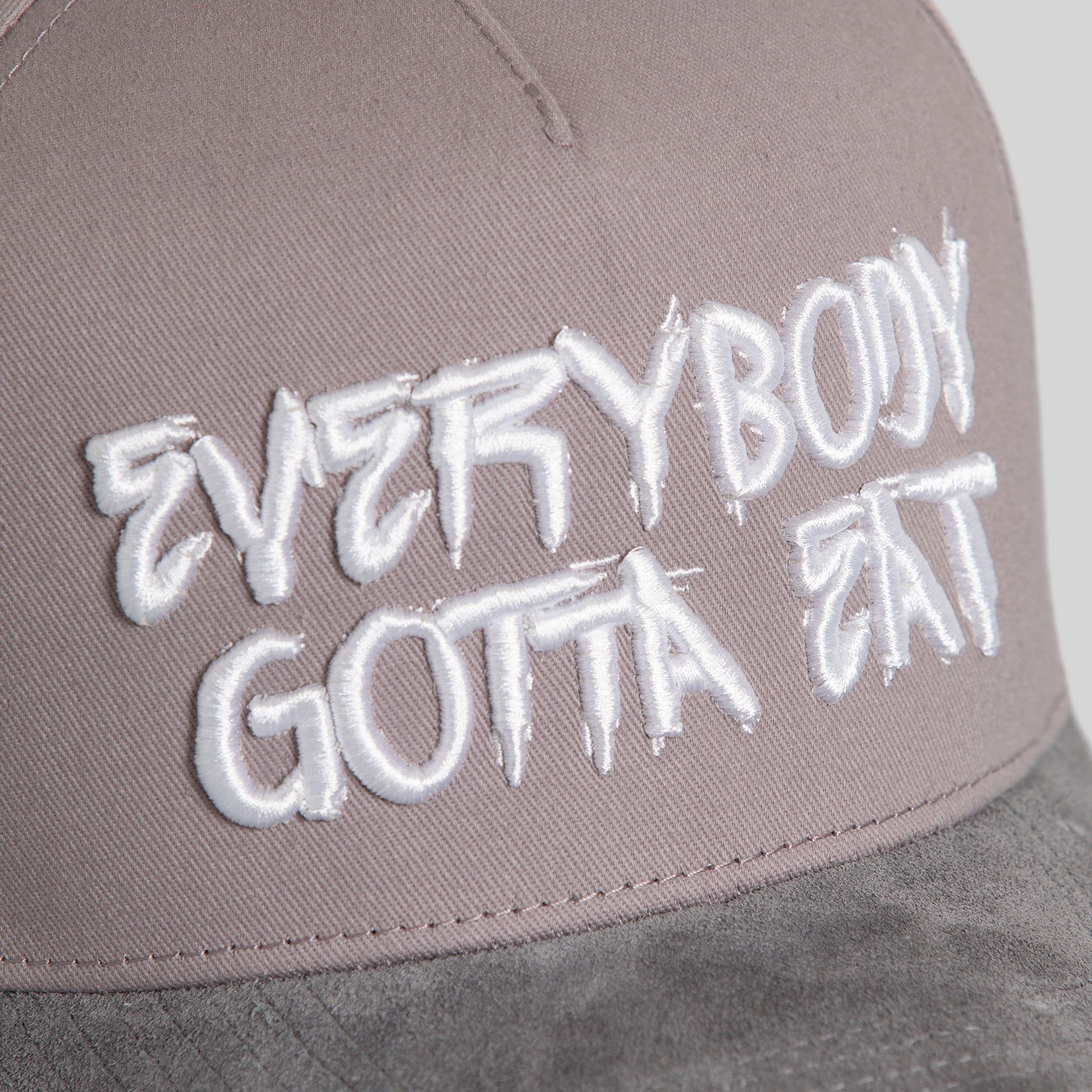 EVERYBODY GOTTA EAT GREYSCALE TWILL SUEDE TRUCKER