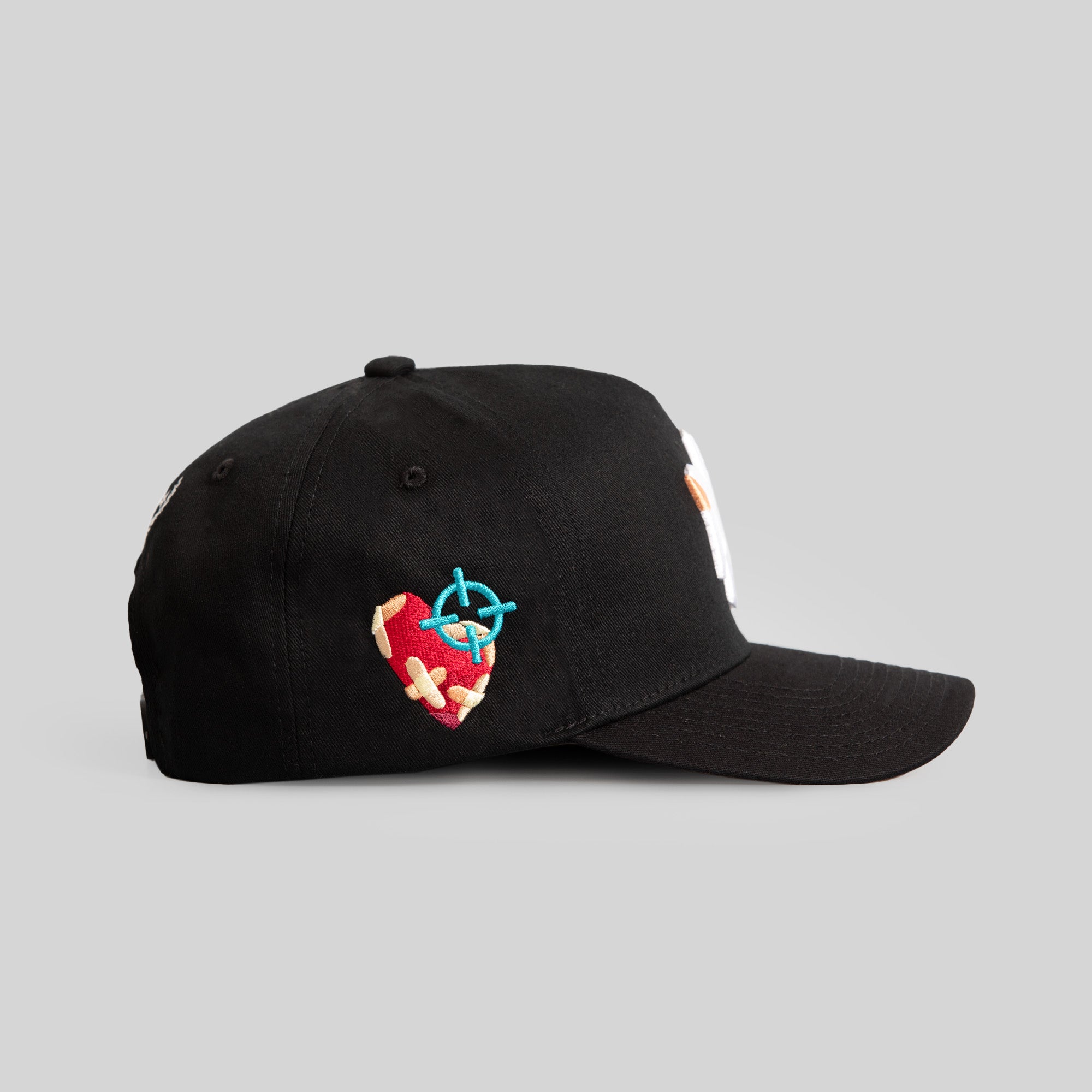 FIELD GRADE X KURVE STUDIO NY IS HEALING BLACK TRUCKER HAT