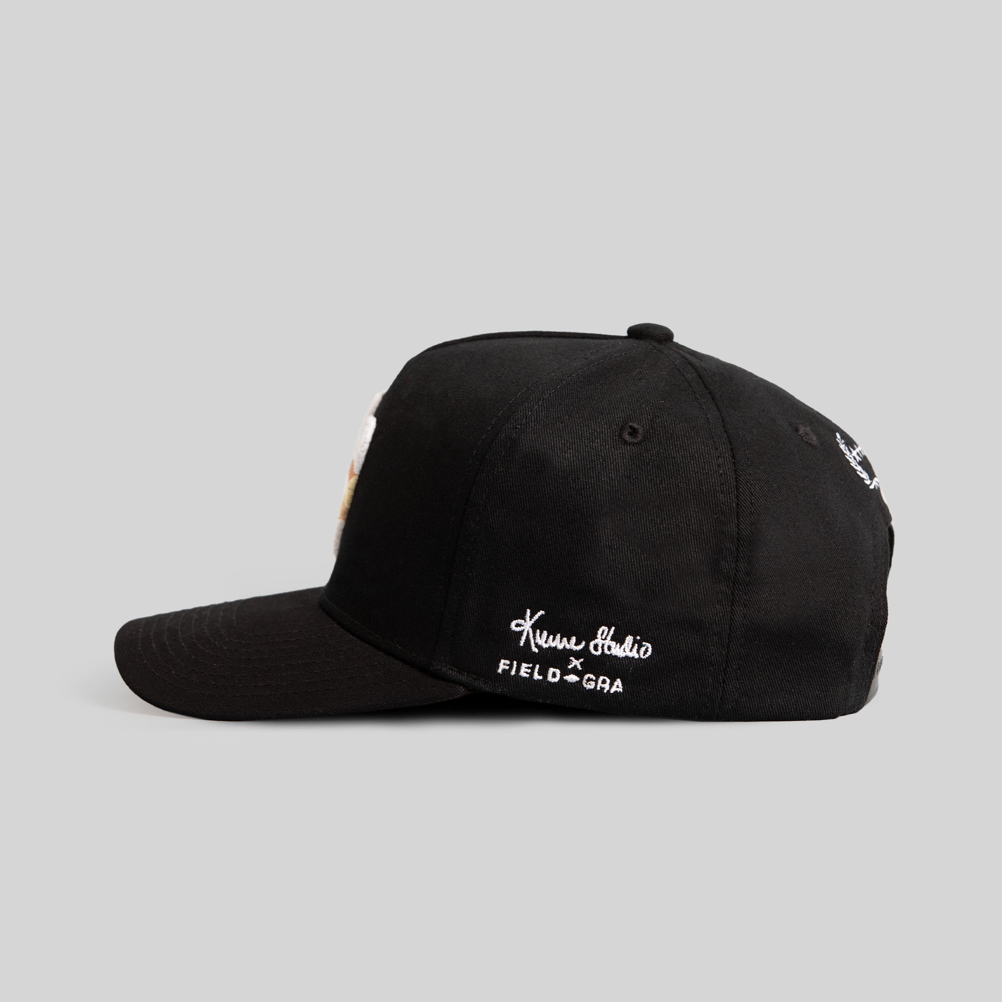 FIELD GRADE X KURVE STUDIO NY IS HEALING BLACK TRUCKER HAT