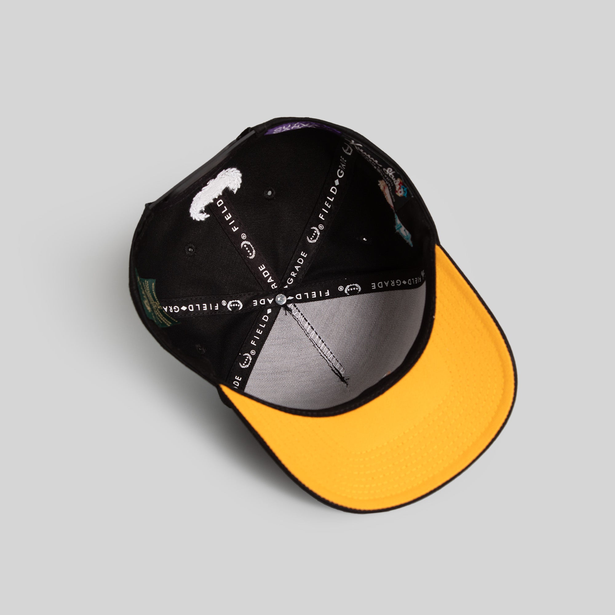 FIELD GRADE X KURVE STUDIO NY IS HEALING BLACK TRUCKER HAT