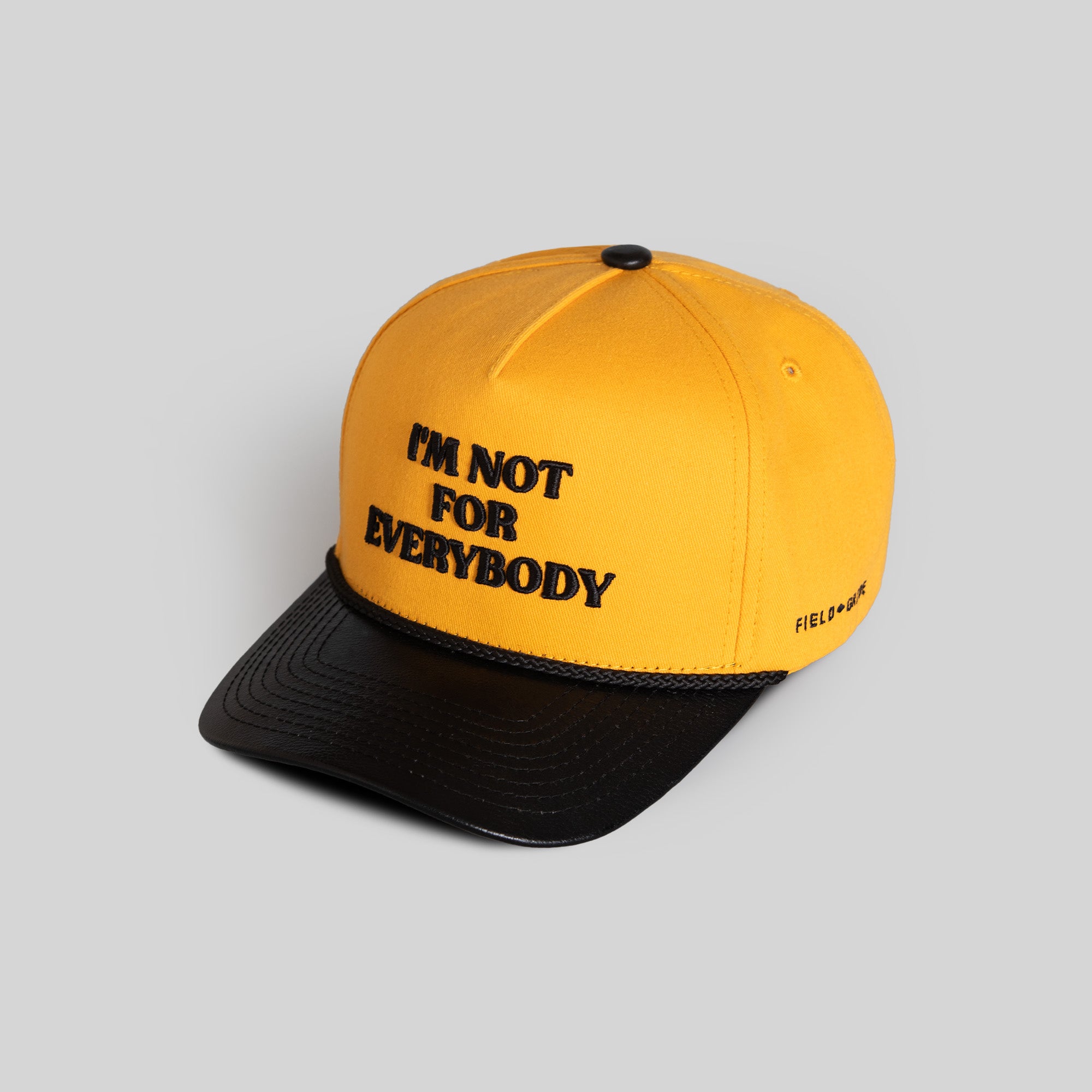 I'M NOT FOR EVERYBODY YELLOW GOLD BLACK TWILL LEATHER TRUCKER