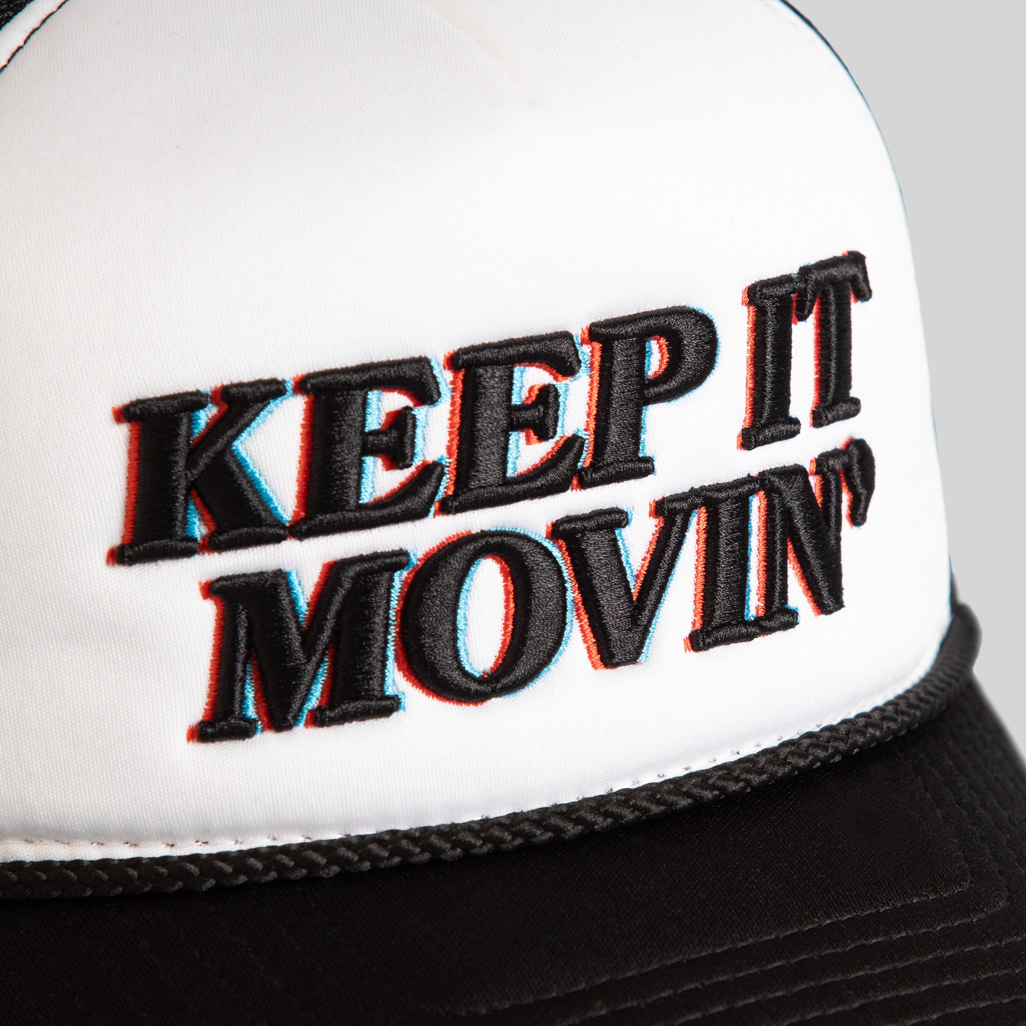 KEEP IT MOVIN' WHITE BLACK TRUCKER HAT