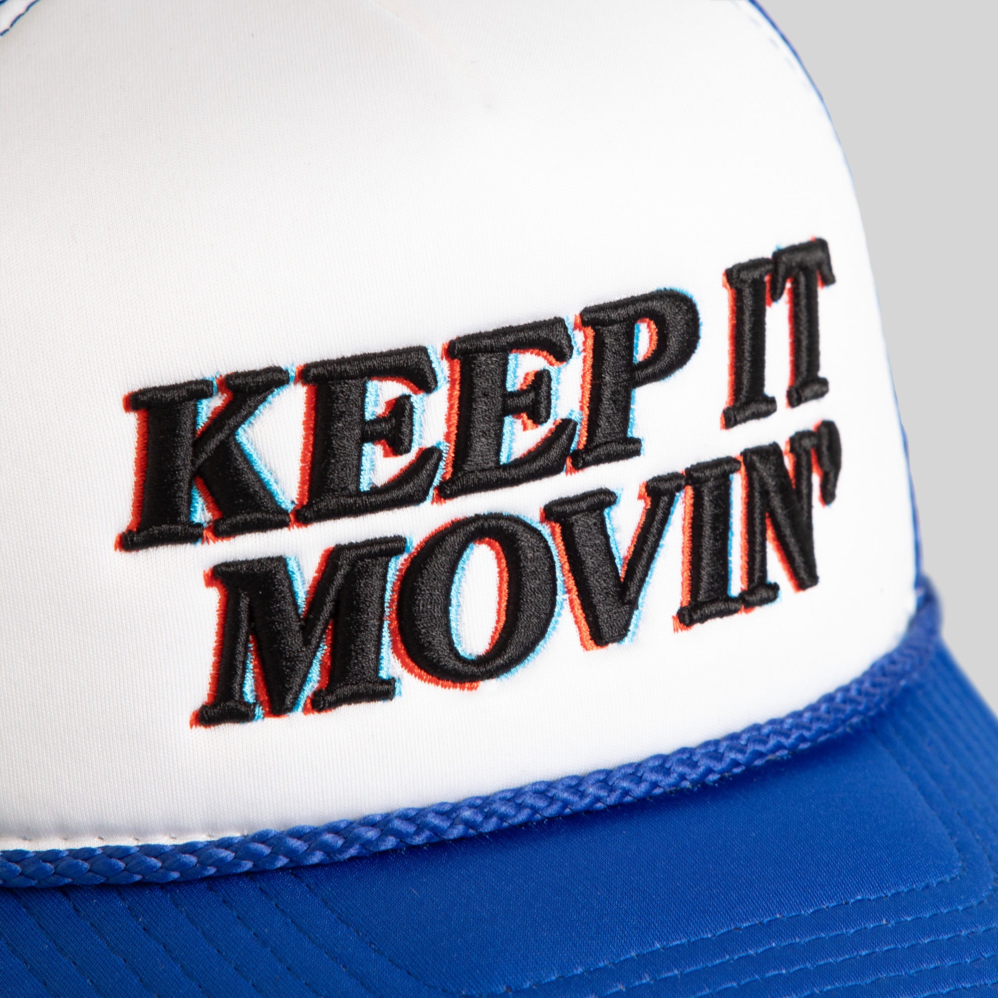 KEEP IT MOVIN' WHITE GAME ROYAL TRUCKER HAT