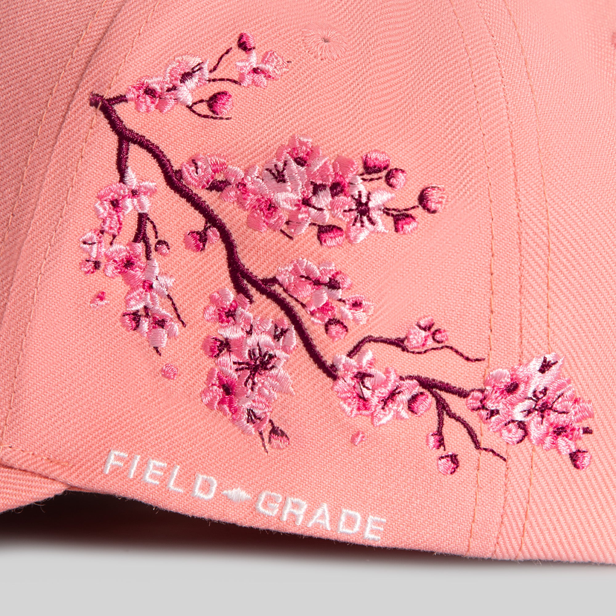 FIELD GRADE X KURVE STUDIO NY IS HEALING CHERRY BLOSSOM WOOL TRUCKER