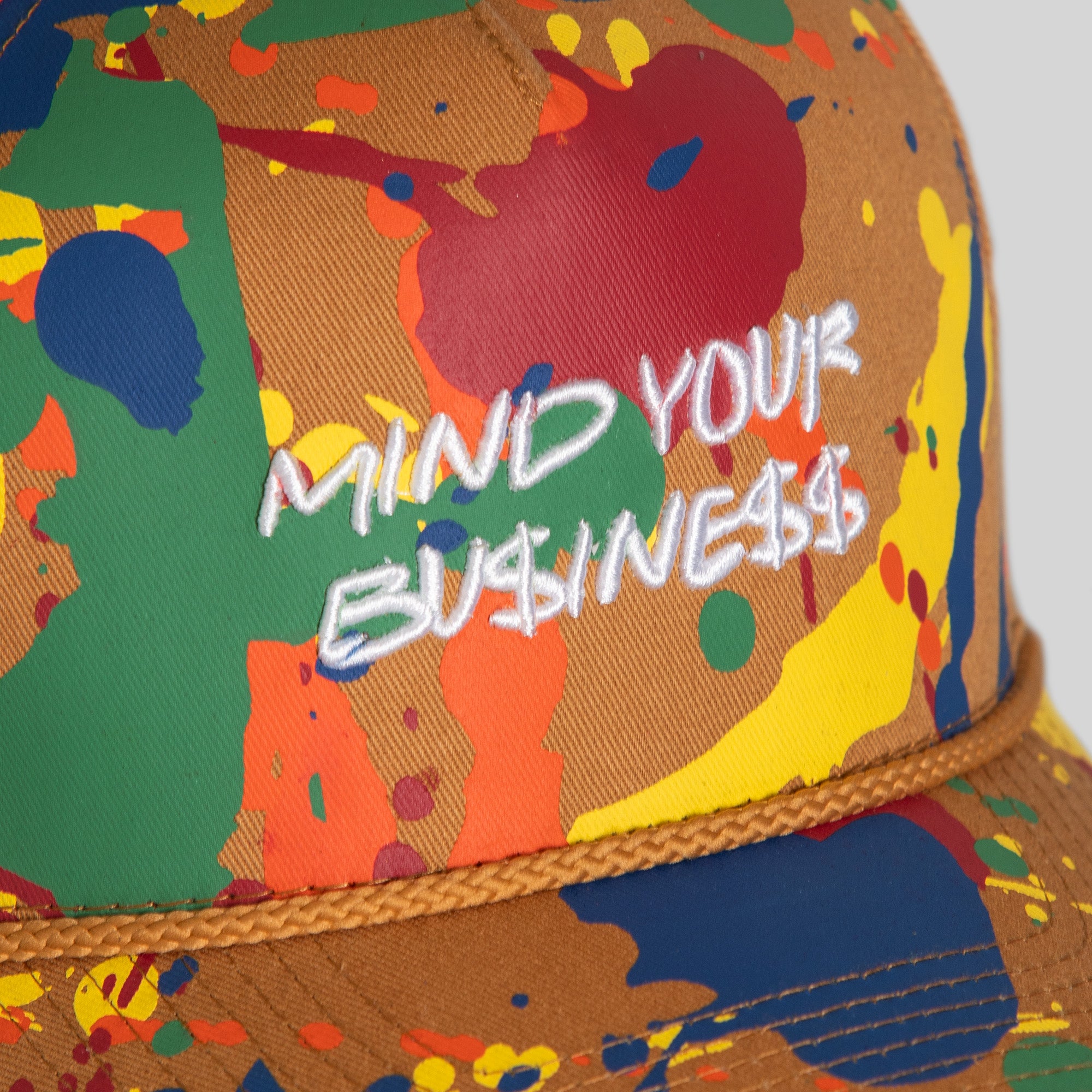 MIND YOUR BUSINESS PRIMARY SPLATTER TWILL TRUCKER