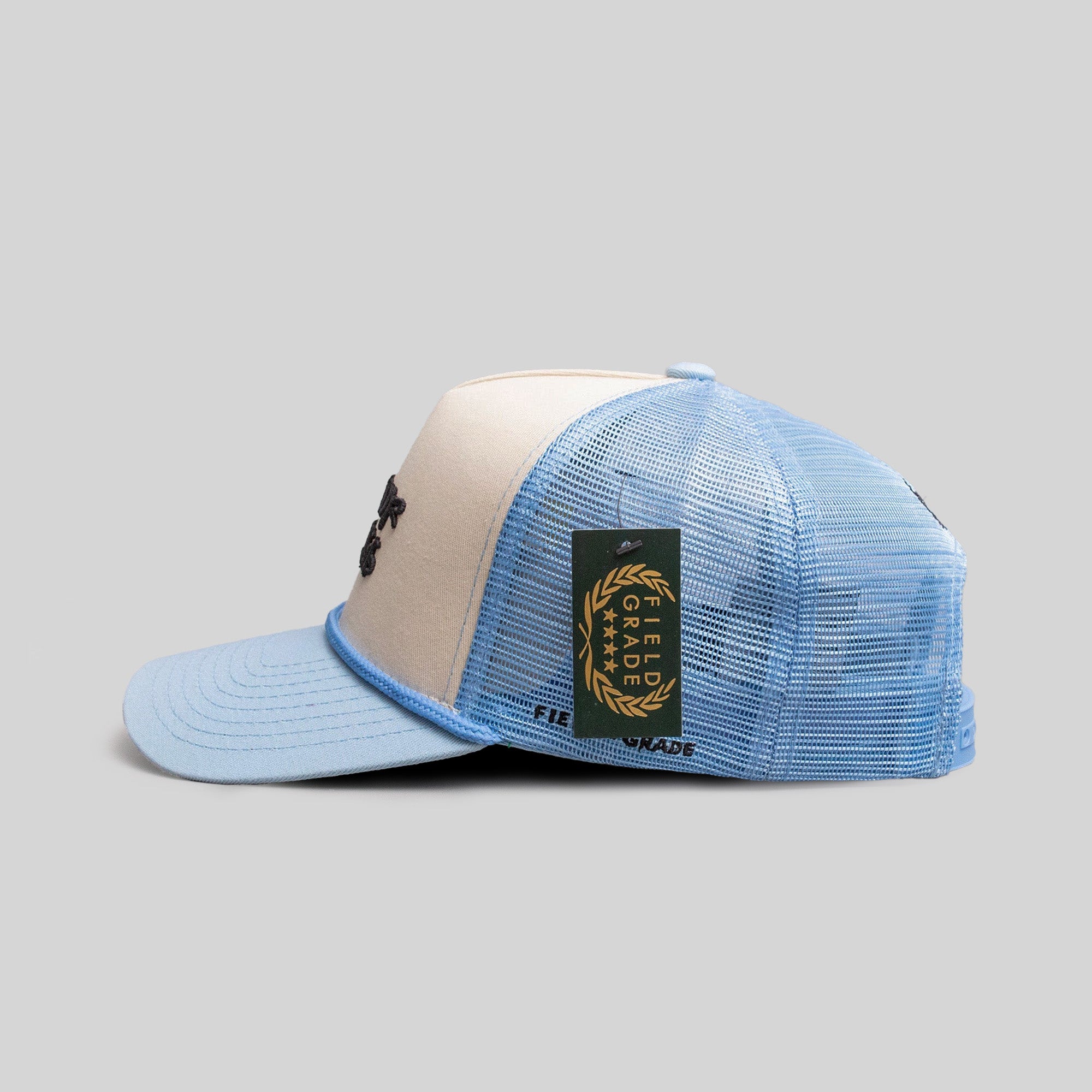 MIND YOUR BUSINESS SAND/UNI BLUE TRUCKER HAT