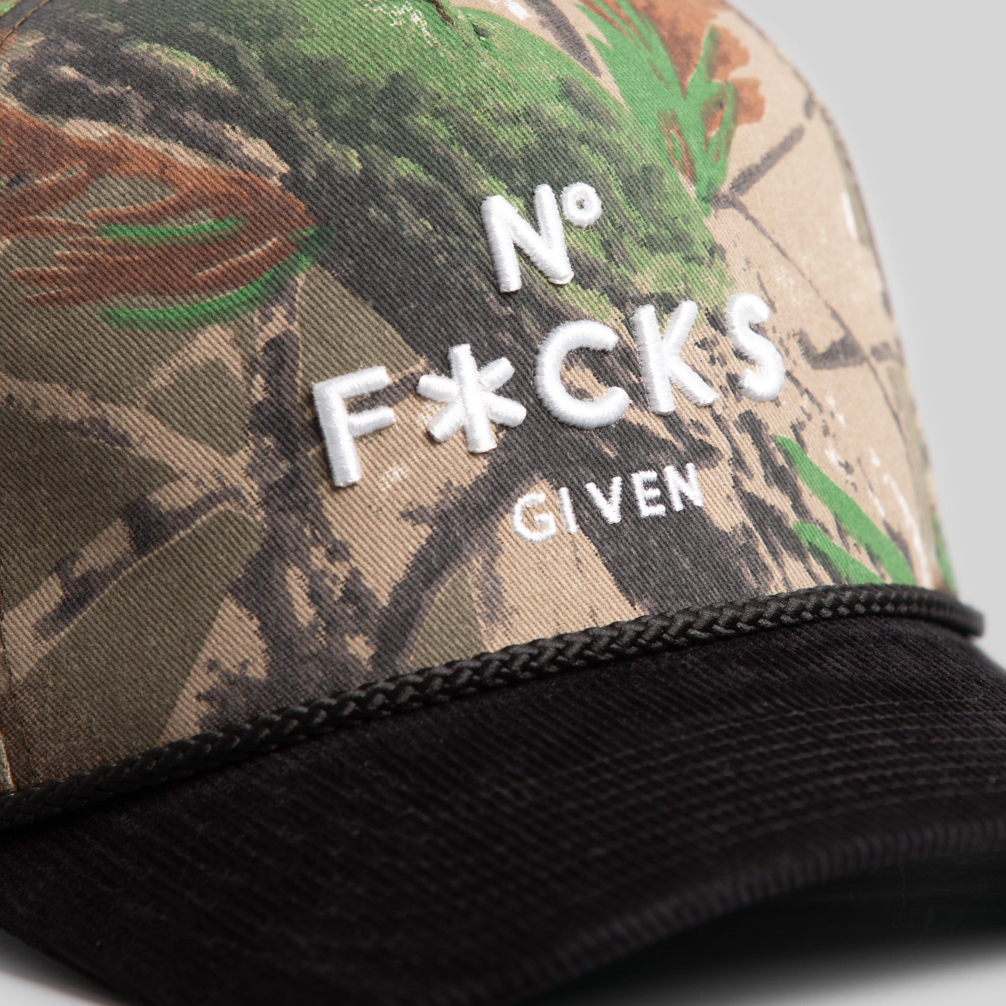 NO F*CKS GIVEN CAMO/BLACK TRUCKER HAT