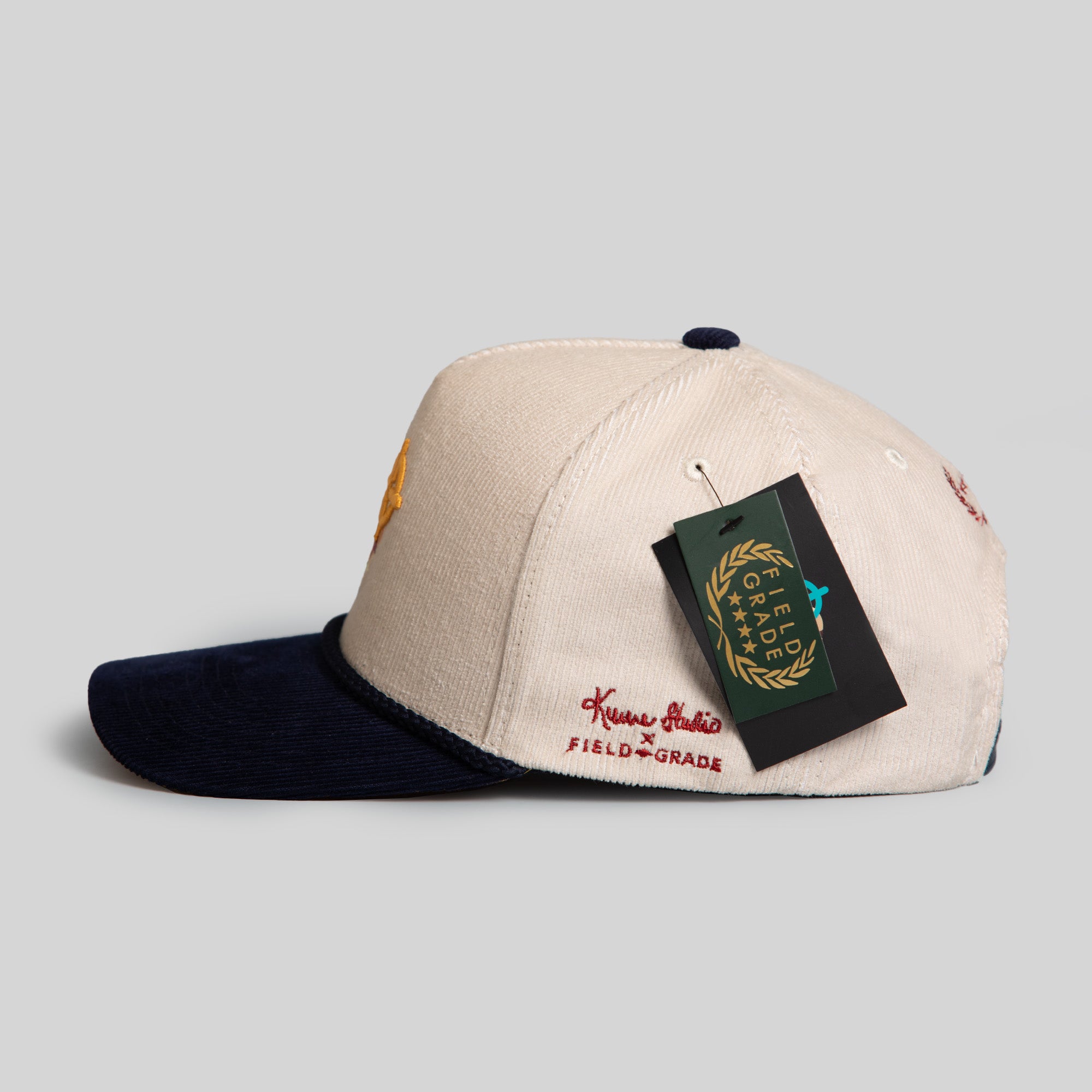 FIELD GRADE X KURVE STUDIO NY IS HEALING STONE/NAVY TRUCKER HAT