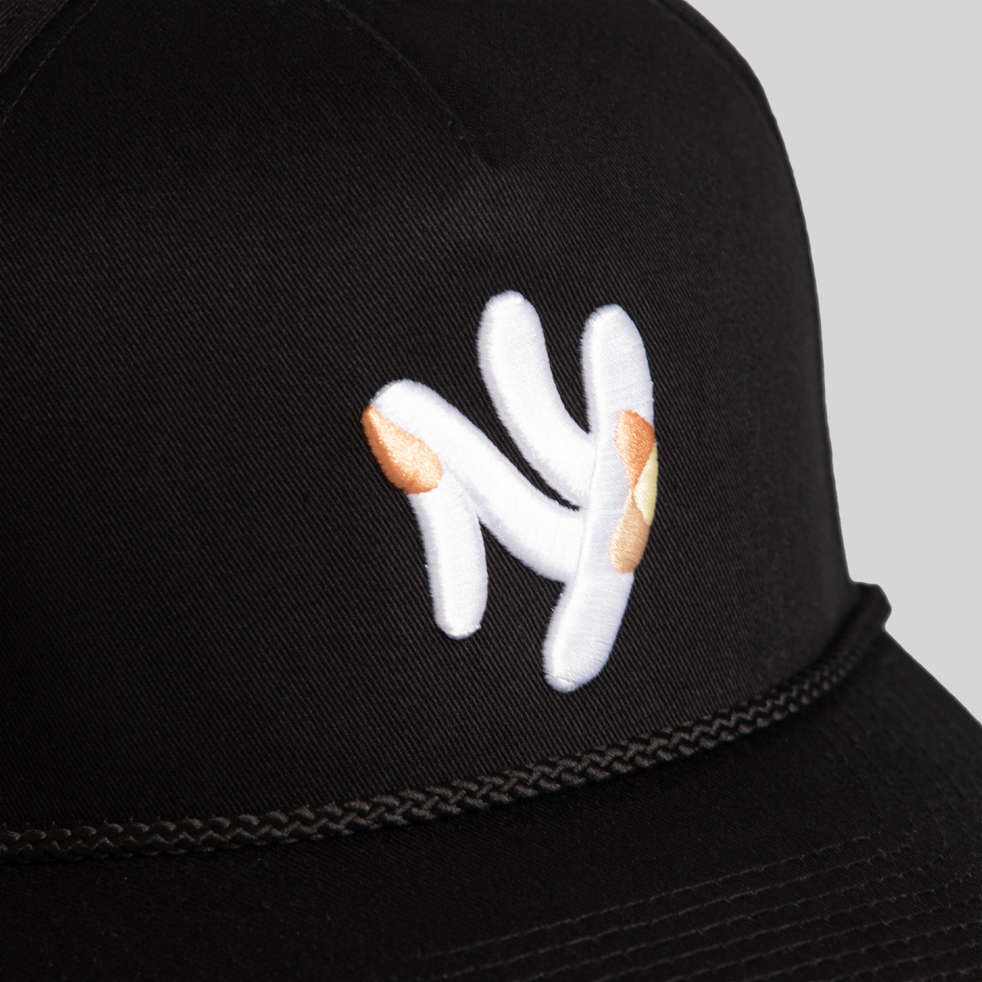 FIELD GRADE X KURVE STUDIO NY IS HEALING BLACK TRUCKER HAT