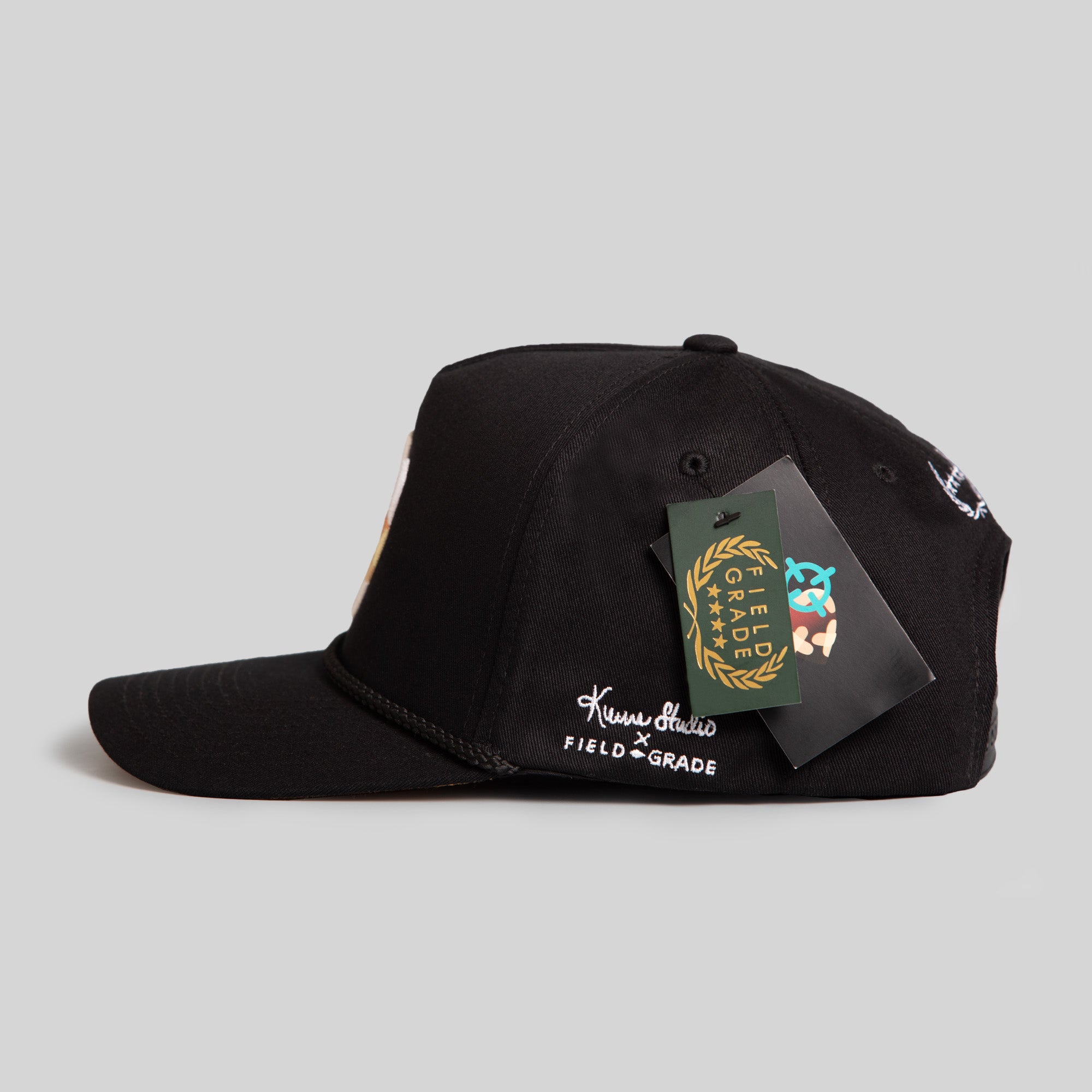 FIELD GRADE X KURVE STUDIO NY IS HEALING BLACK TRUCKER HAT