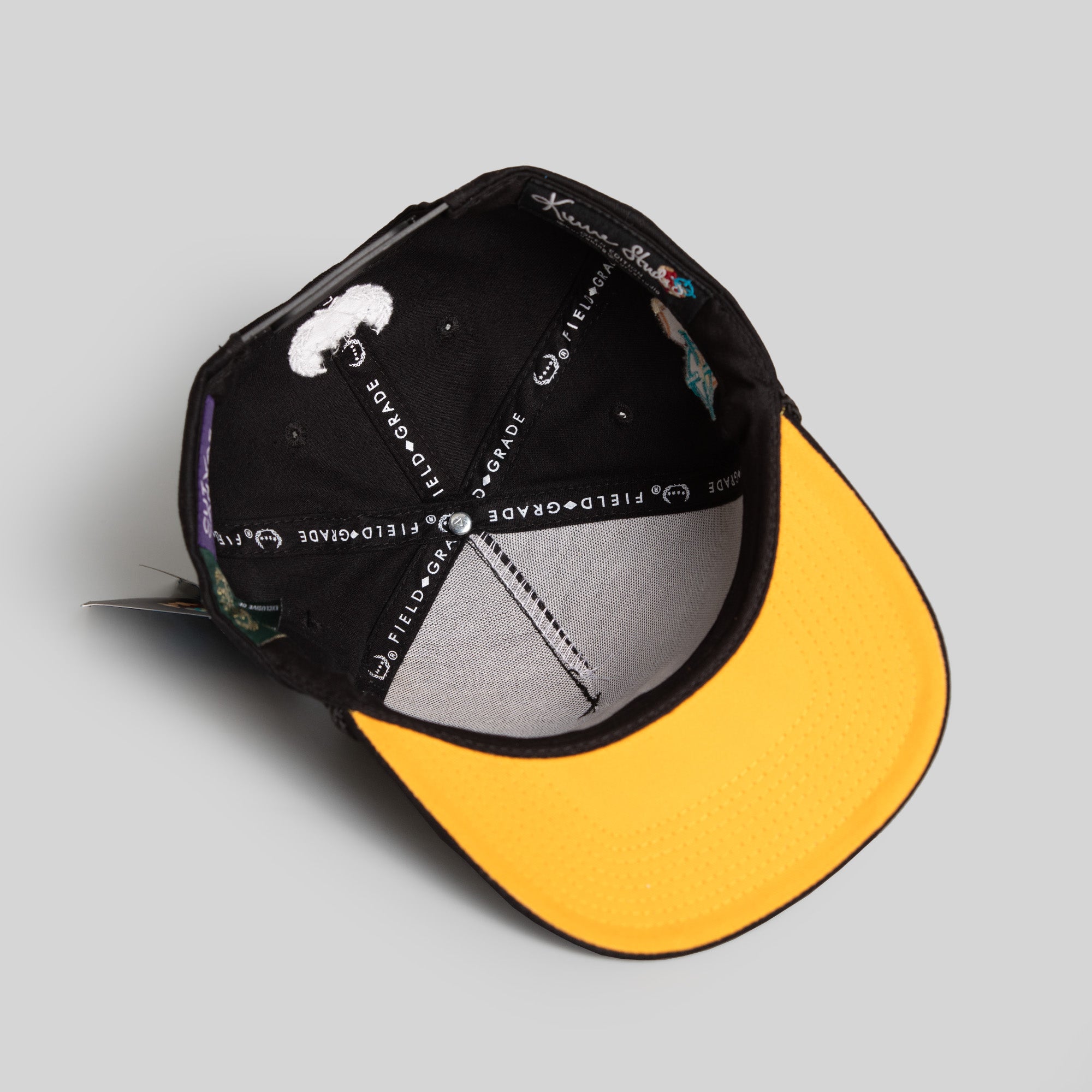 FIELD GRADE X KURVE STUDIO NY IS HEALING BLACK TRUCKER HAT