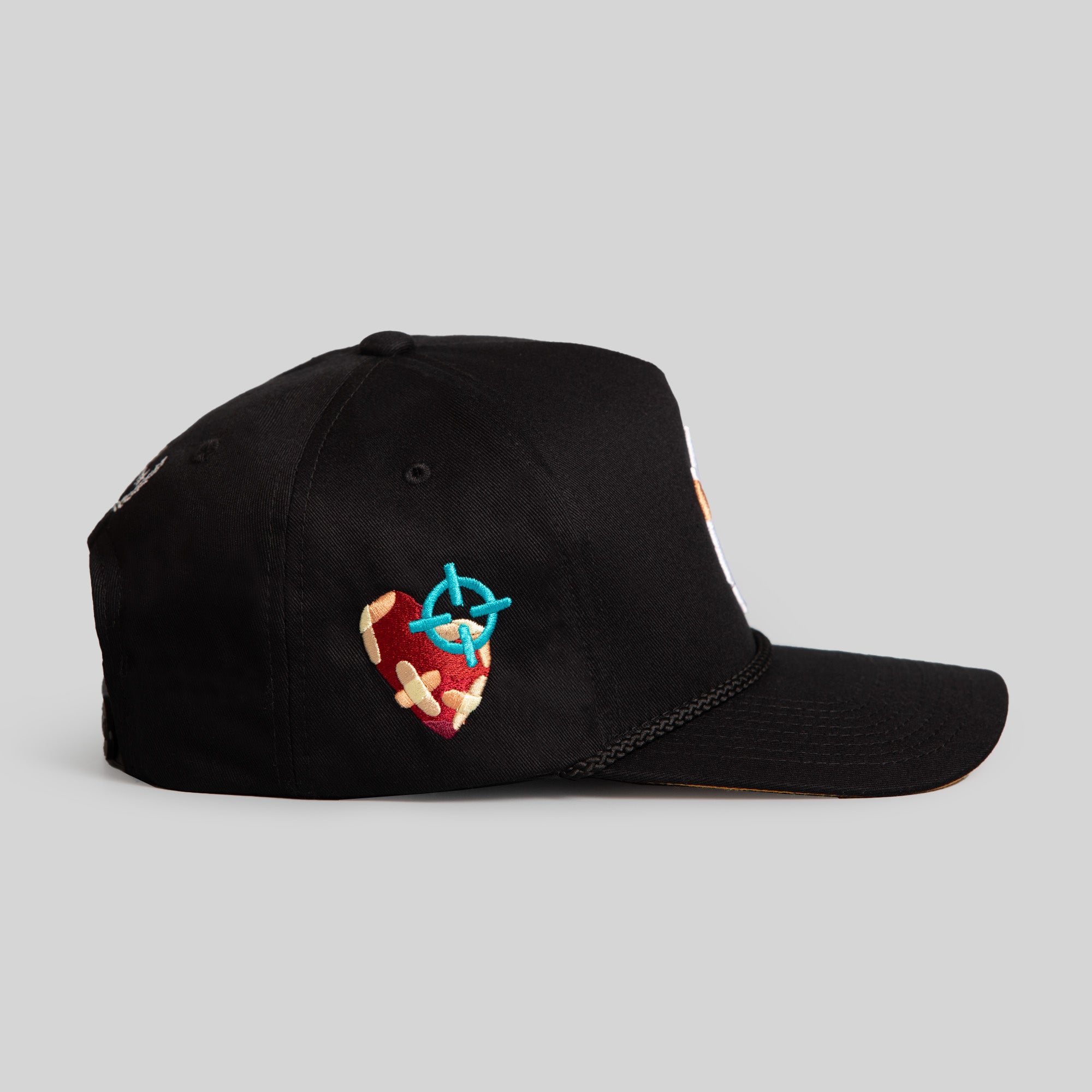 FIELD GRADE X KURVE STUDIO NY IS HEALING BLACK TRUCKER HAT