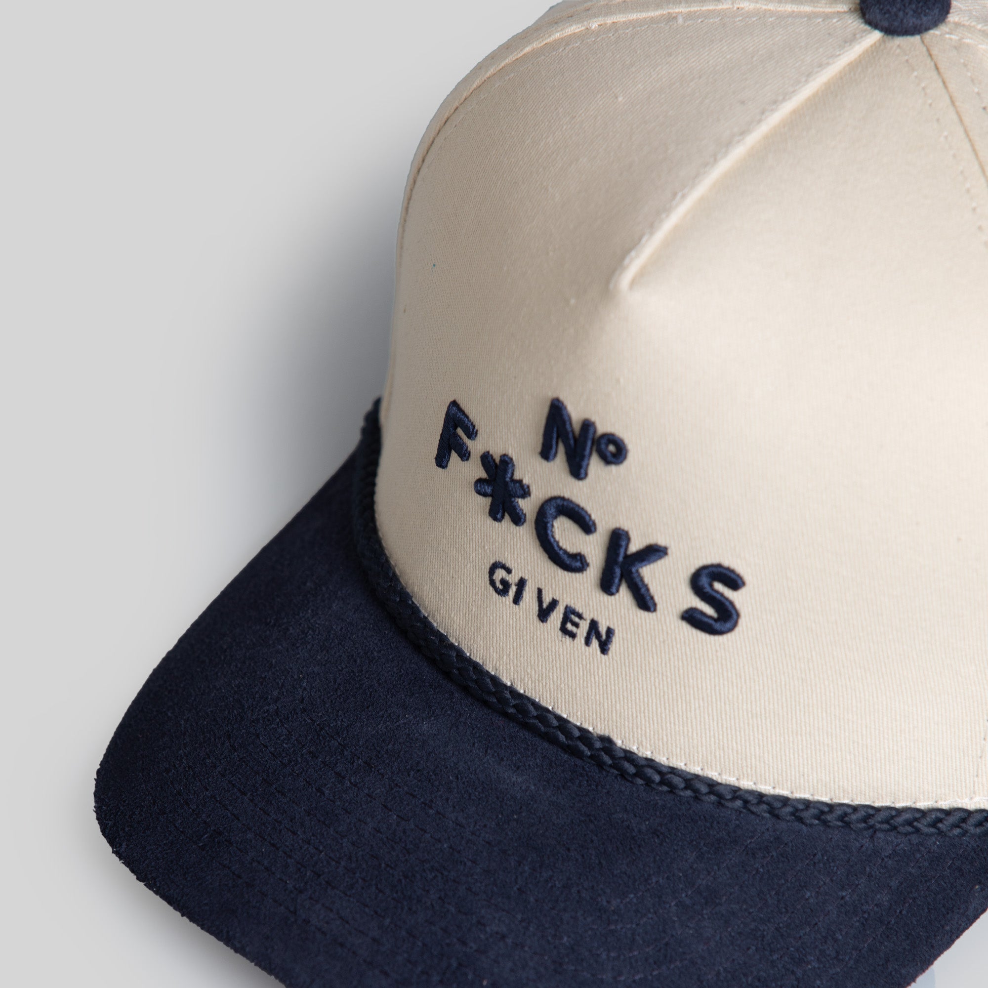 NO F*CKS GIVEN SAND NAVY TWILL/SUEDE TRUCKER HAT