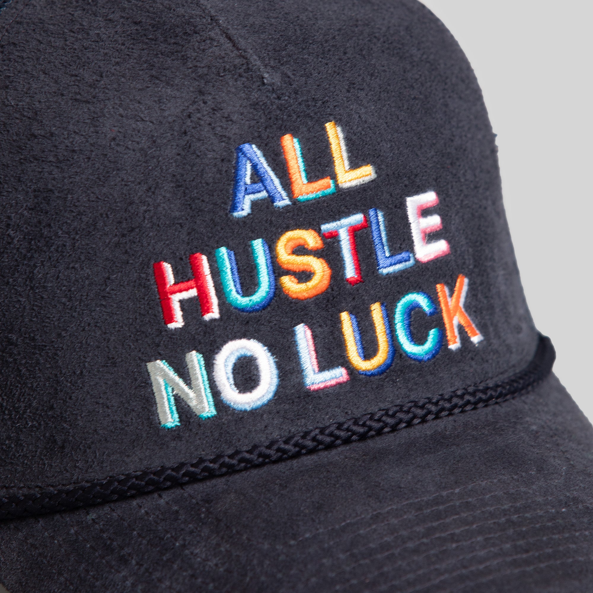 ALL HUSTLE NO LUCK NAVY SUEDE TRUCKER HAT