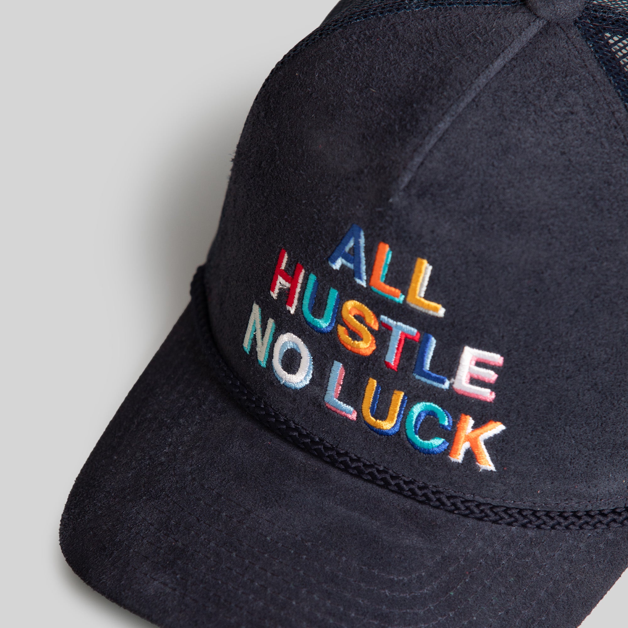 ALL HUSTLE NO LUCK NAVY SUEDE TRUCKER HAT