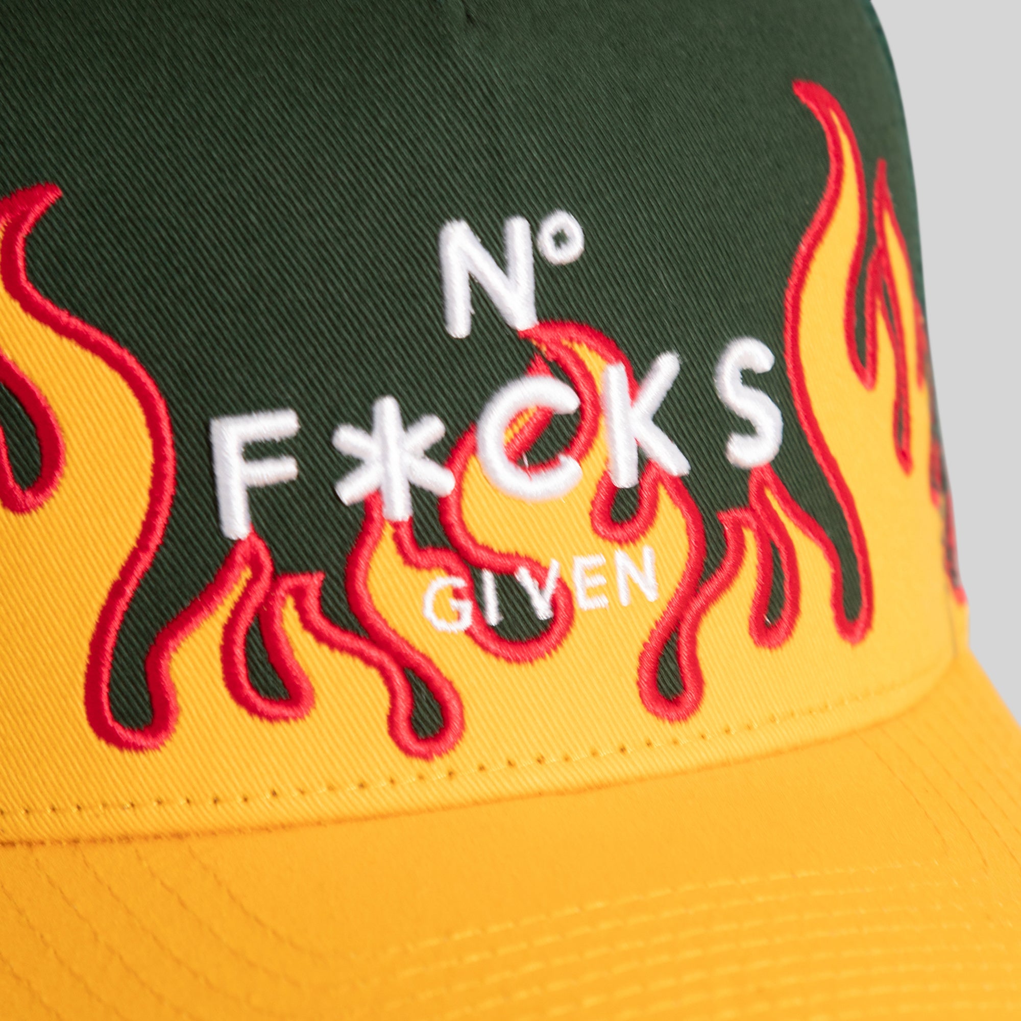 NO F*CKS GIVEN FLAMETOOTH EMERALD ATHLETIC GOLD TWILL MESH TRUCKER