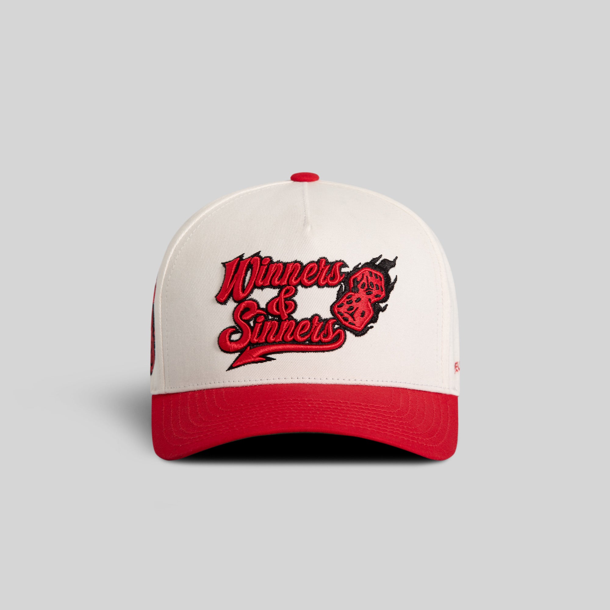 WINNERS AND SINNERS OFF WHITE VARSITY RED TWILL TRUCKER