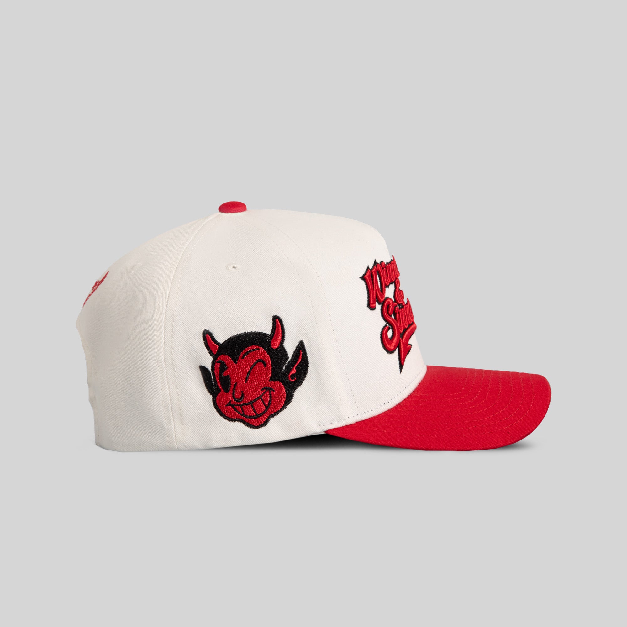 WINNERS AND SINNERS OFF WHITE VARSITY RED TWILL TRUCKER