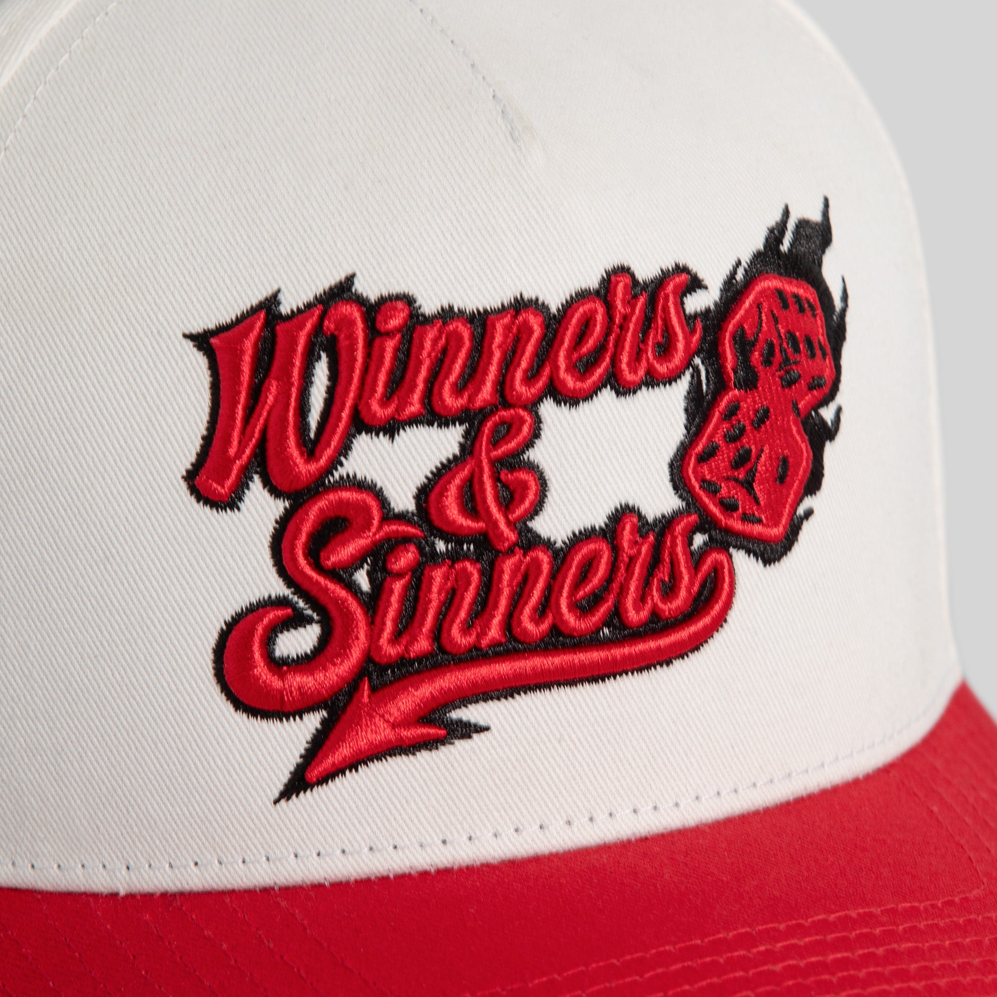 WINNERS AND SINNERS OFF WHITE VARSITY RED TWILL TRUCKER