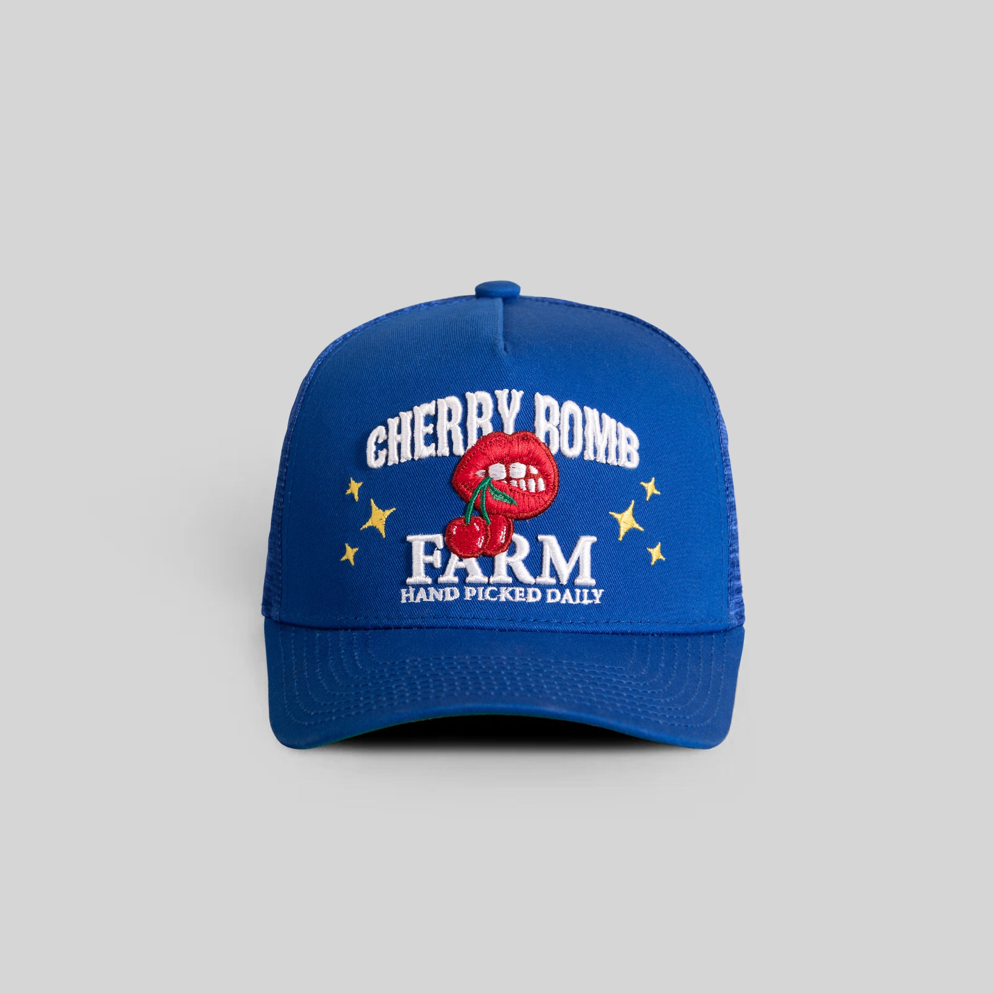 CHERRY BOMB ROYAL TWILL MESH TRUCKER