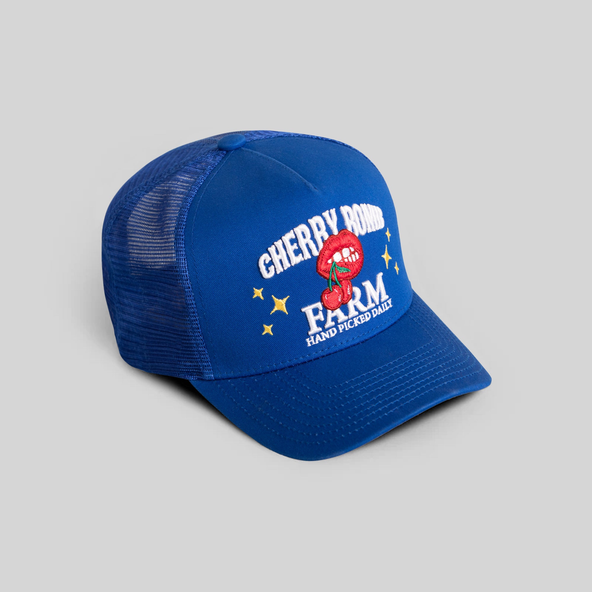 CHERRY BOMB ROYAL TWILL MESH TRUCKER