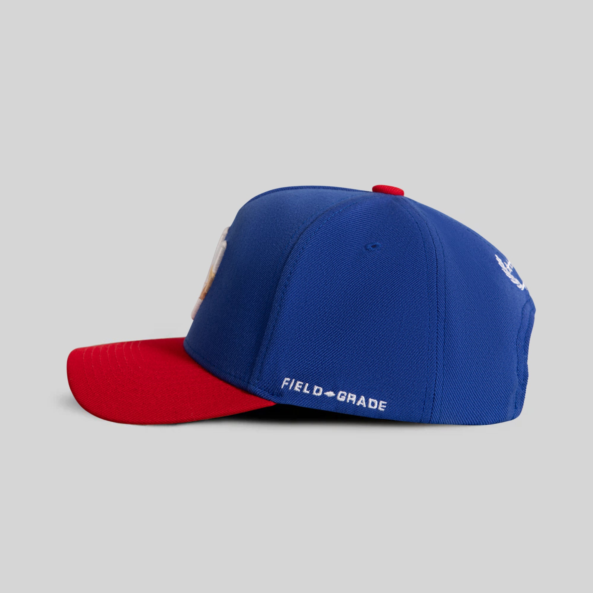 FIELD GRADE X KURVE STUDIO NY IS HEALING GAME ROYAL VARSITY RED TRUCKER