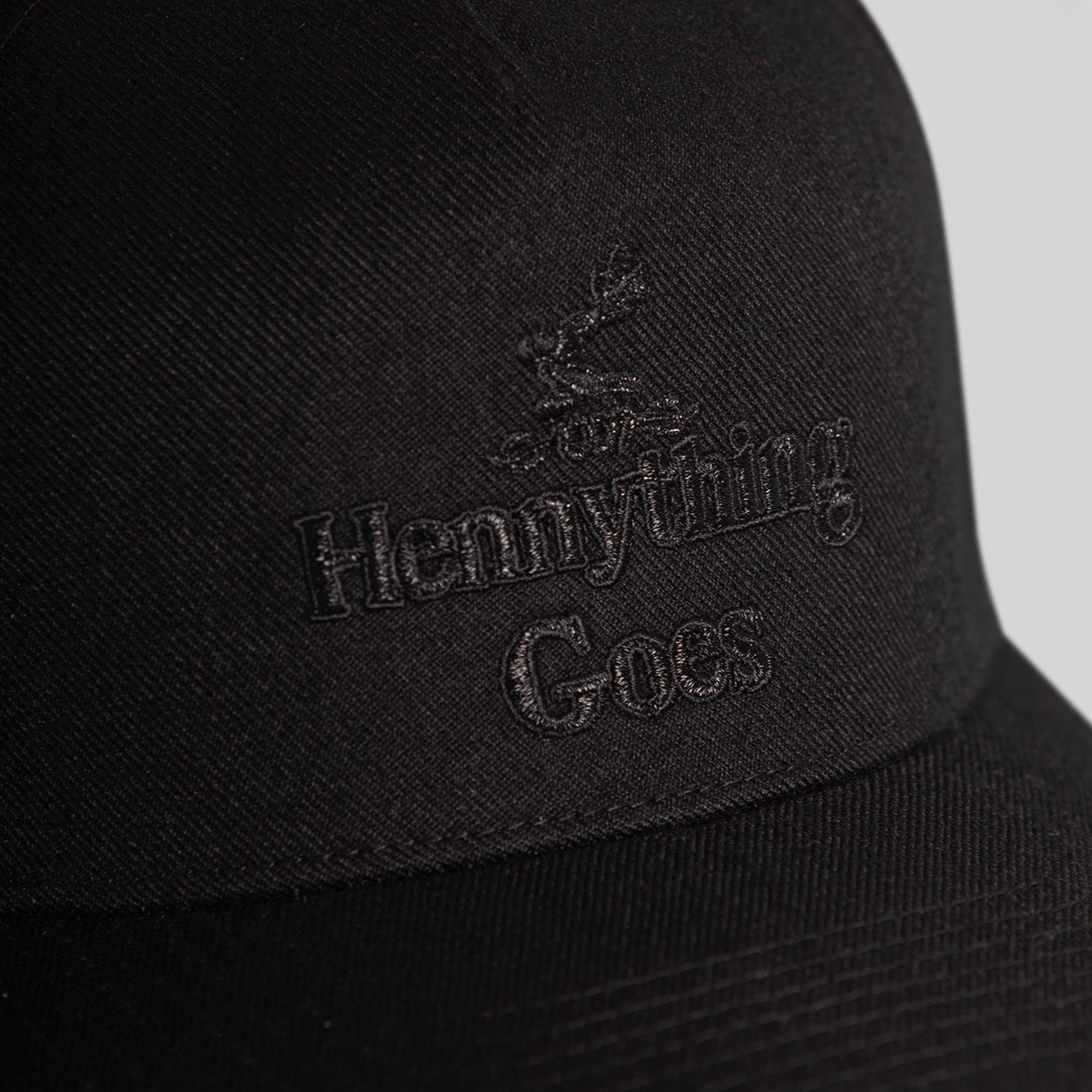 HENNYTHING GOES BLACKOUT WOOL TRUCKER