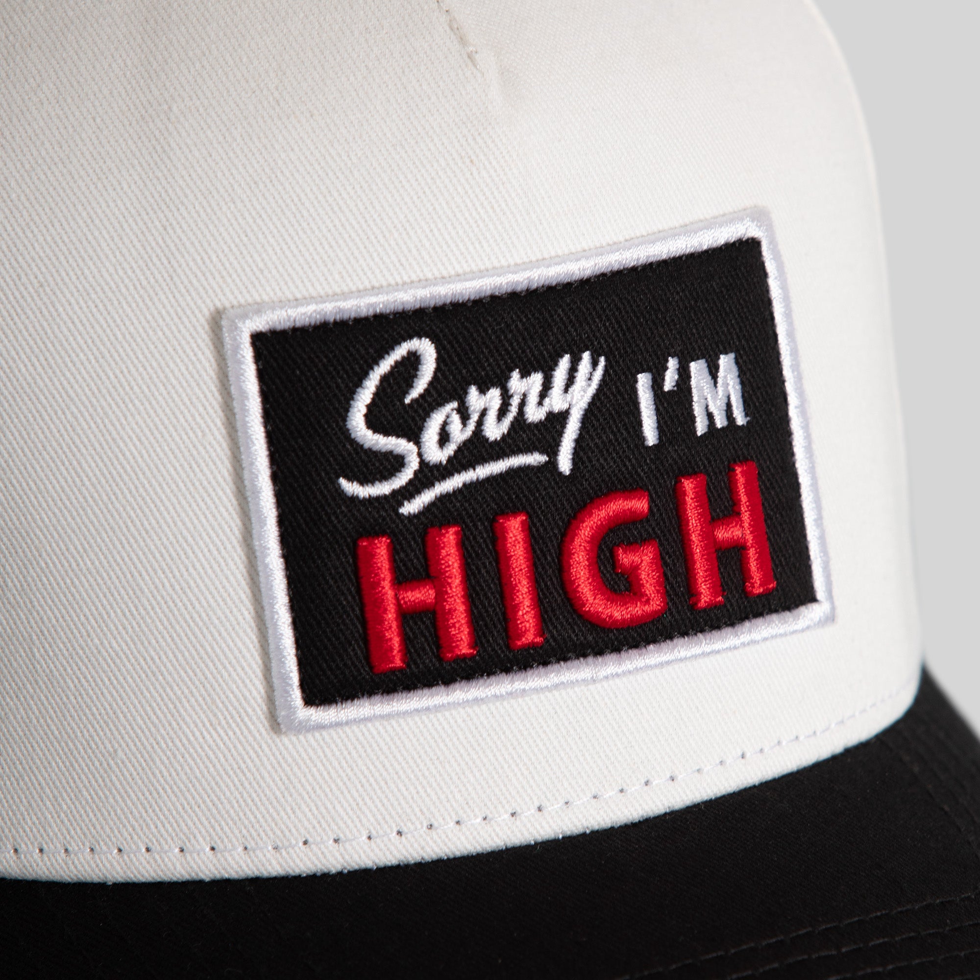 SORRY I'M HIGH EGGSHELL BLACK TWILL TRUCKER