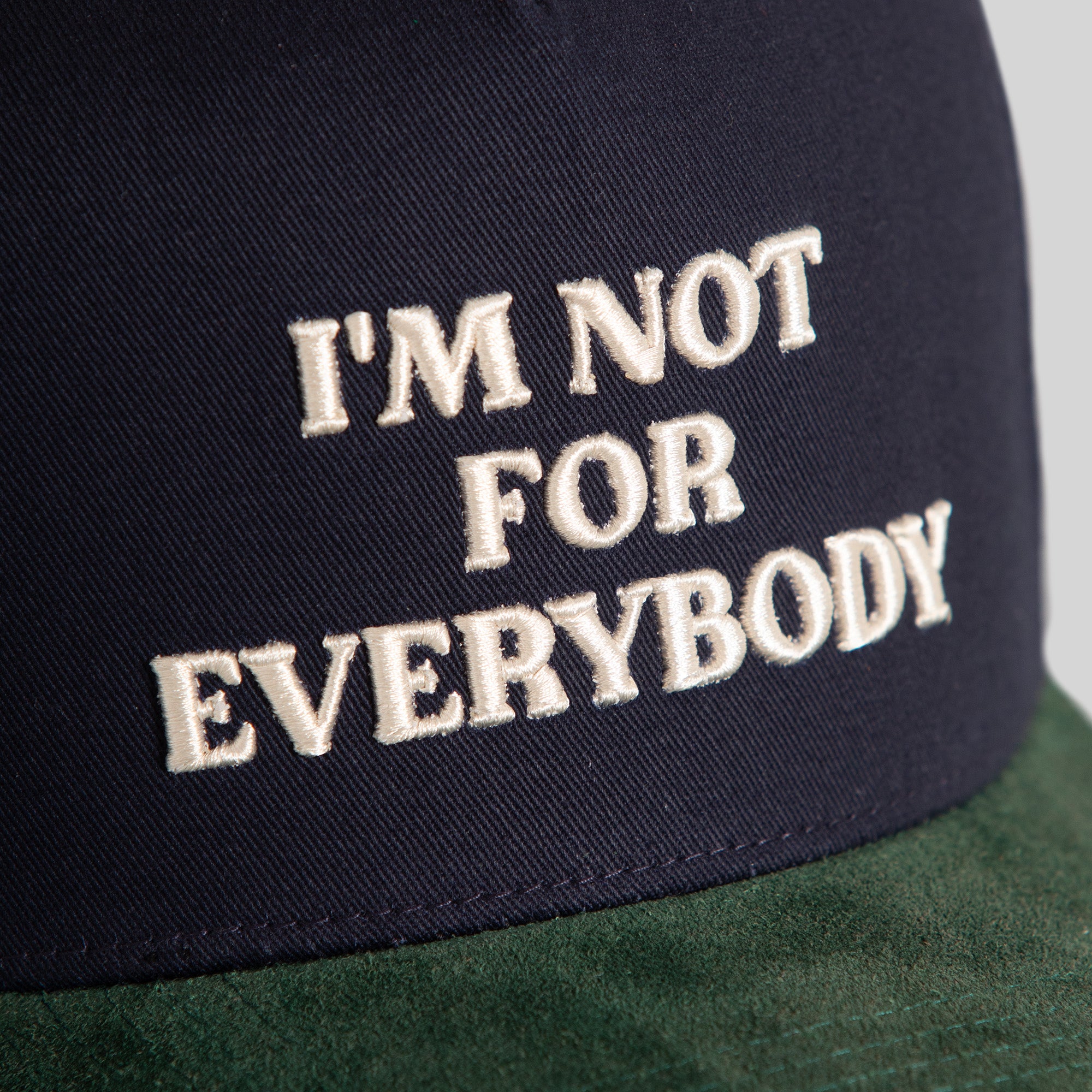 I'M NOT FOR EVERYBODY DEEP NAVY FG GREEN TWILL SUEDE TRUCKER
