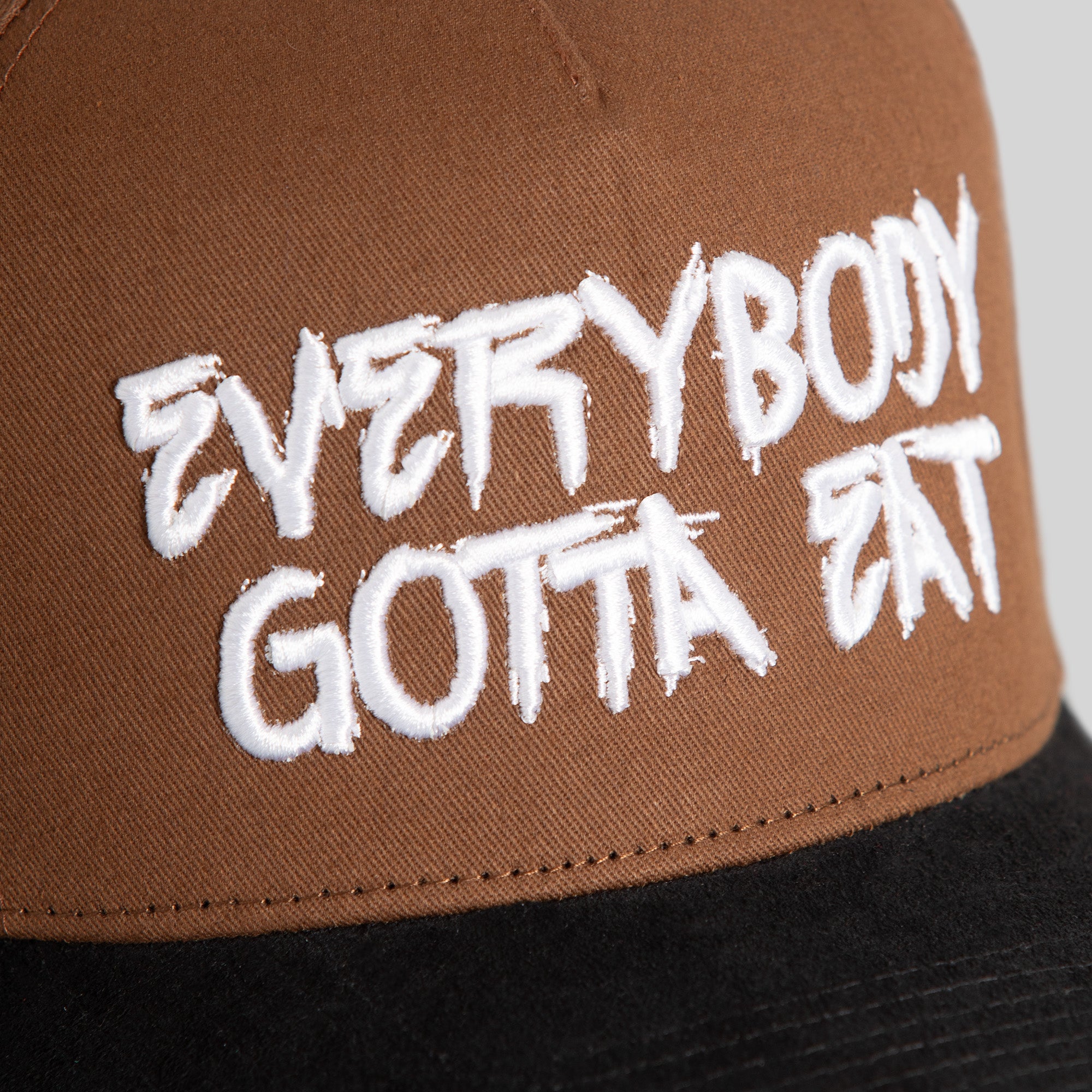 EVERYBODY GOTTA EAT SESAME BLACK TWILL SUEDE TRUCKER