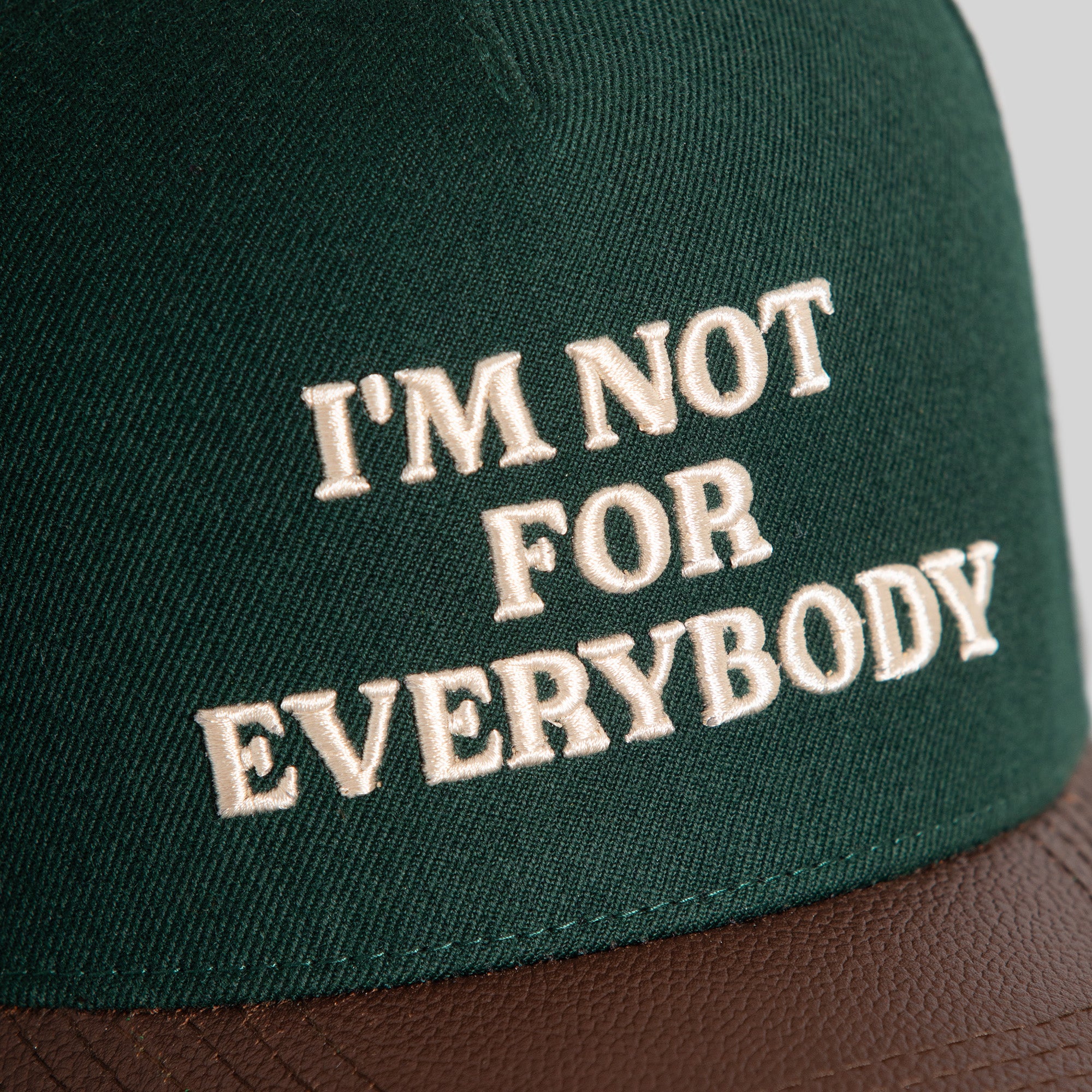 I'M NOT FOR EVERYBODY FG GREEN MOCHA WOOL LEATHER TRUCKER
