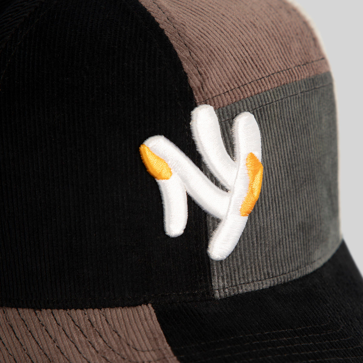 FIELD GRADE X KURVE STUDIO NY IS HEALING MULTI CORDUROY PATCHWORK TRUCKER