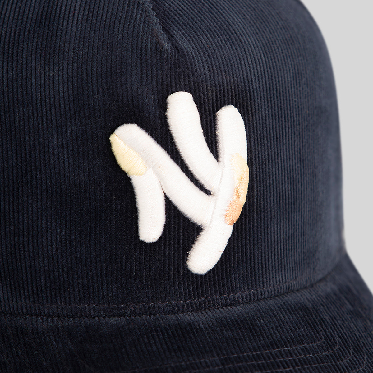 FIELD GRADE X KURVE STUDIO NY IS HEALING WASHED CORDUROY DEEP NAVY TRUCKER