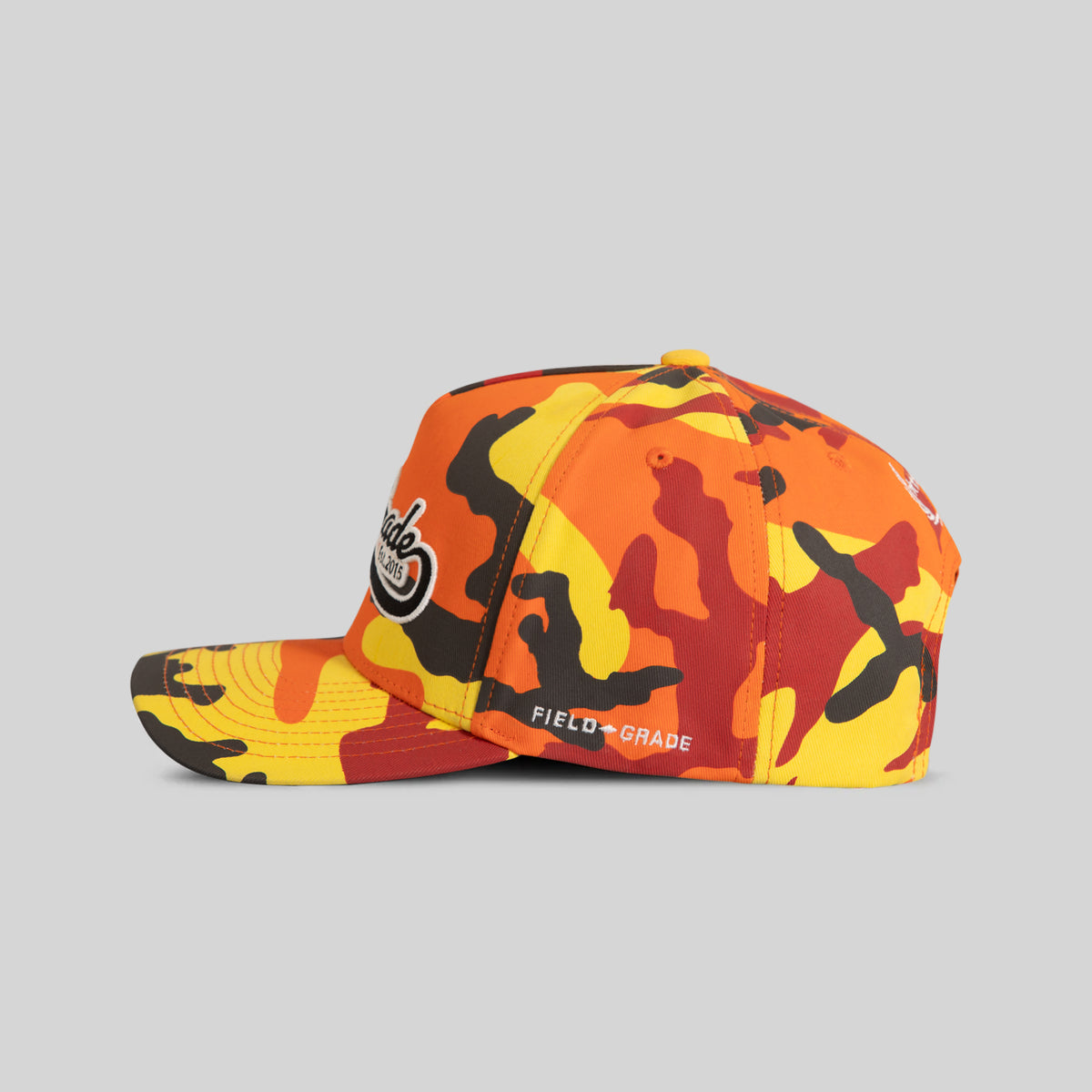 FIELD GRADE COLLEGIATE FLAME CAMO TWILL TRUCKER