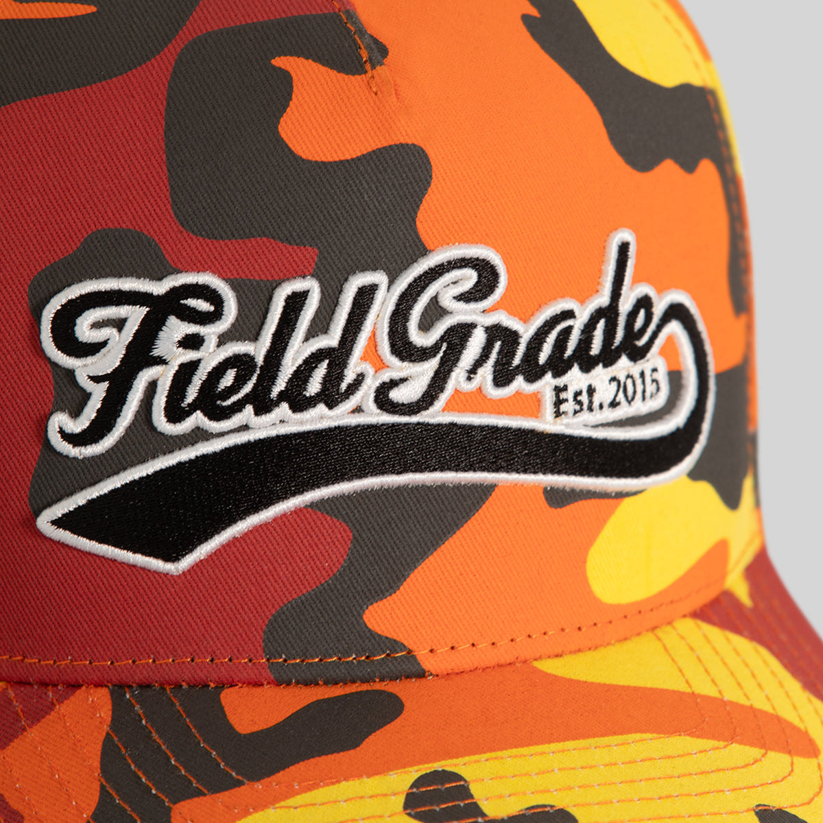 FIELD GRADE COLLEGIATE FLAME CAMO TWILL TRUCKER